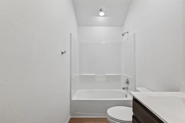 a bathroom with a sink toilet and bathtub