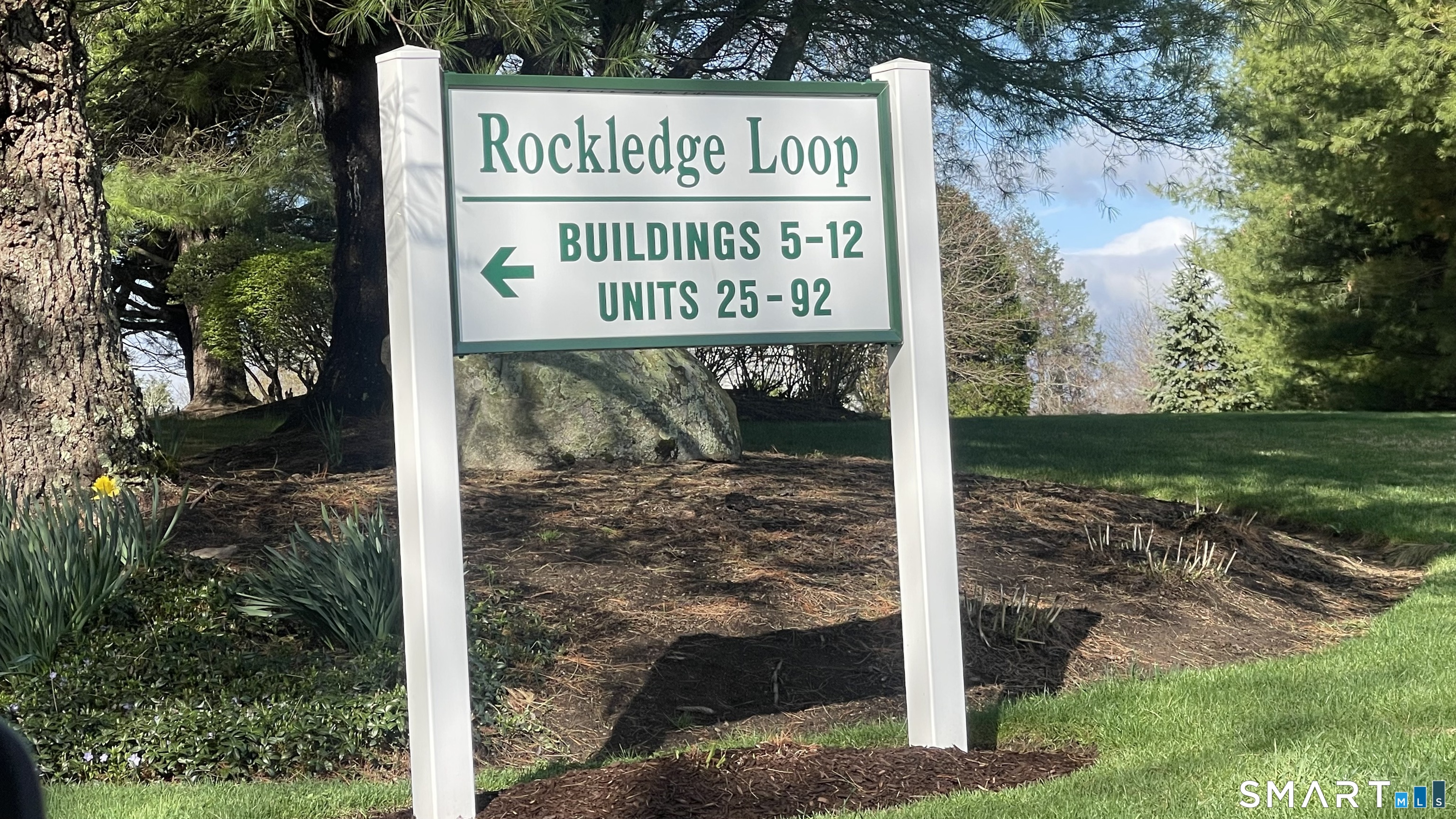 68 Rockledge Loop, Unit 68 Torrington, CT 06790 - Photo 24 of 24 a sign on the side of the road