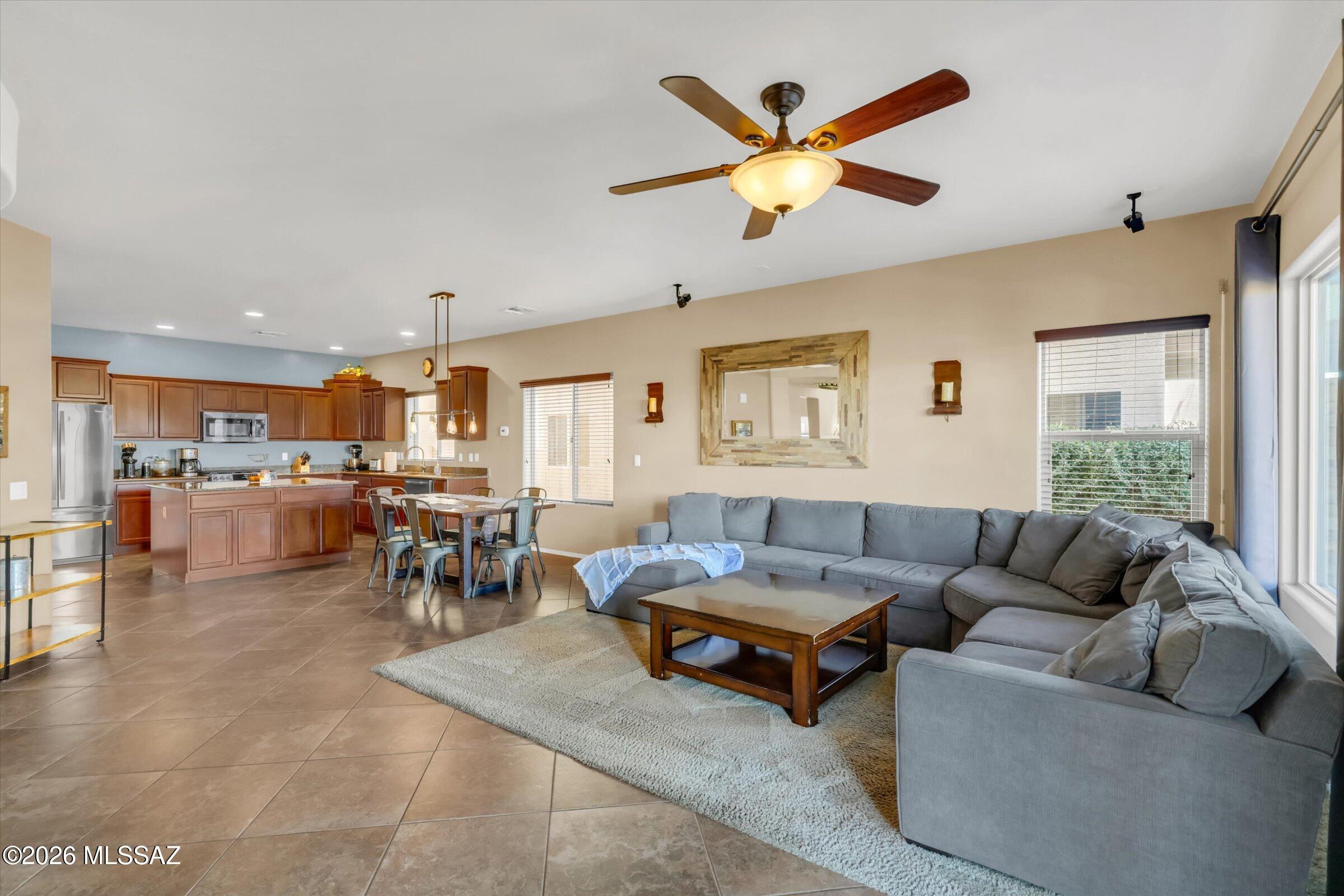 6095 South Jakemp Trail Tucson, AZ 85747 - Photo 18 of 52 a living room with furniture kitchen view and a window