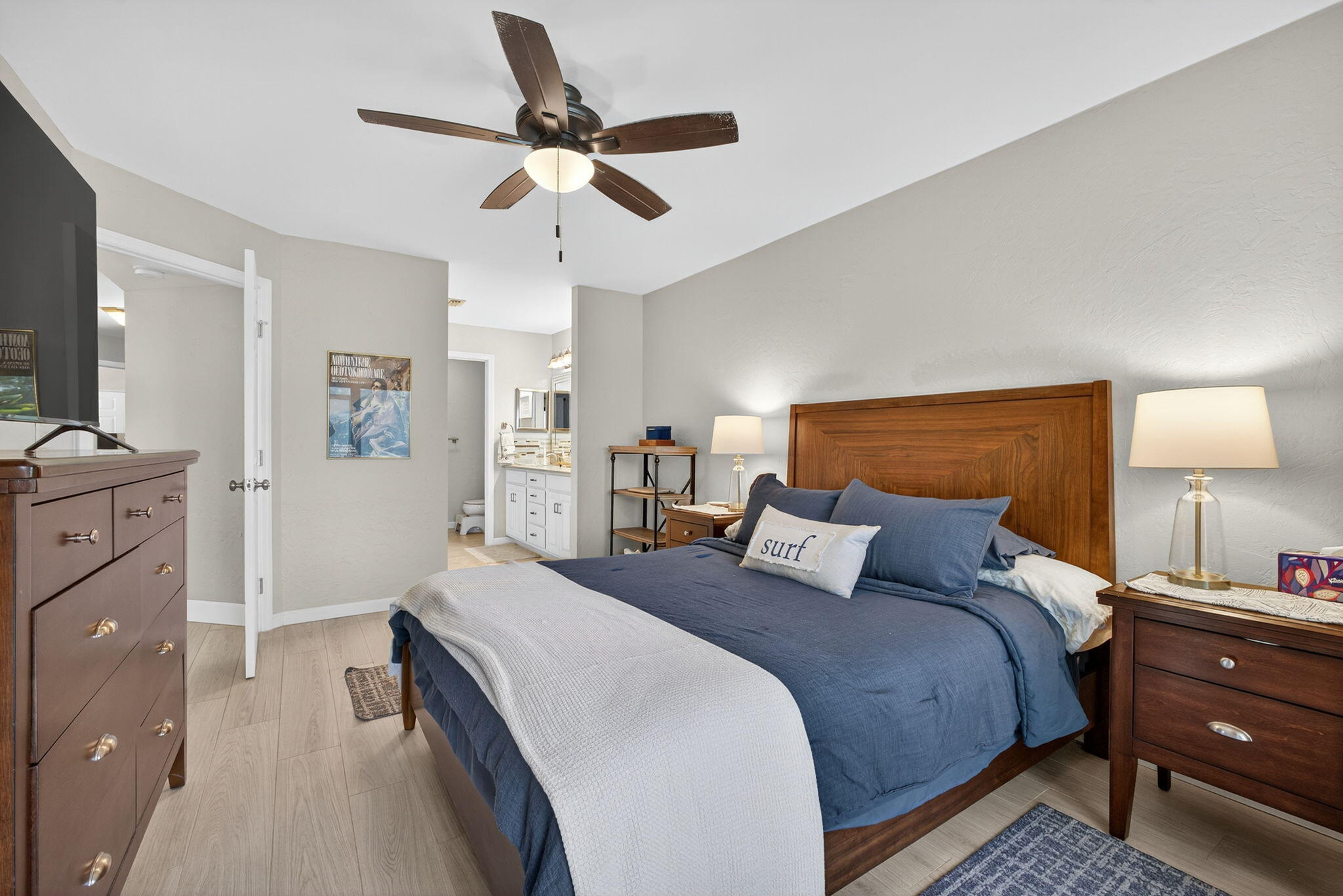 406 Harbour Pointe Way Greenacres, FL 33413 - Photo 41 of 79 a bedroom with a bed and a flat tv screen on dresser