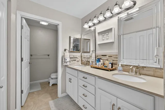 an aerial view of a houses with a yard