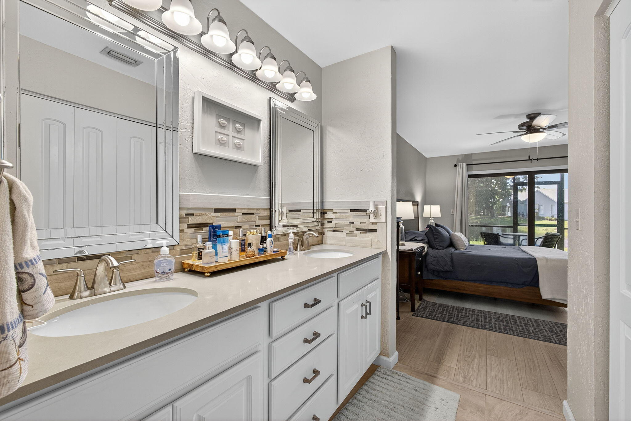 406 Harbour Pointe Way Greenacres, FL 33413 - Photo 43 of 79 a spacious en suite bathroom with double vanity and a mirror