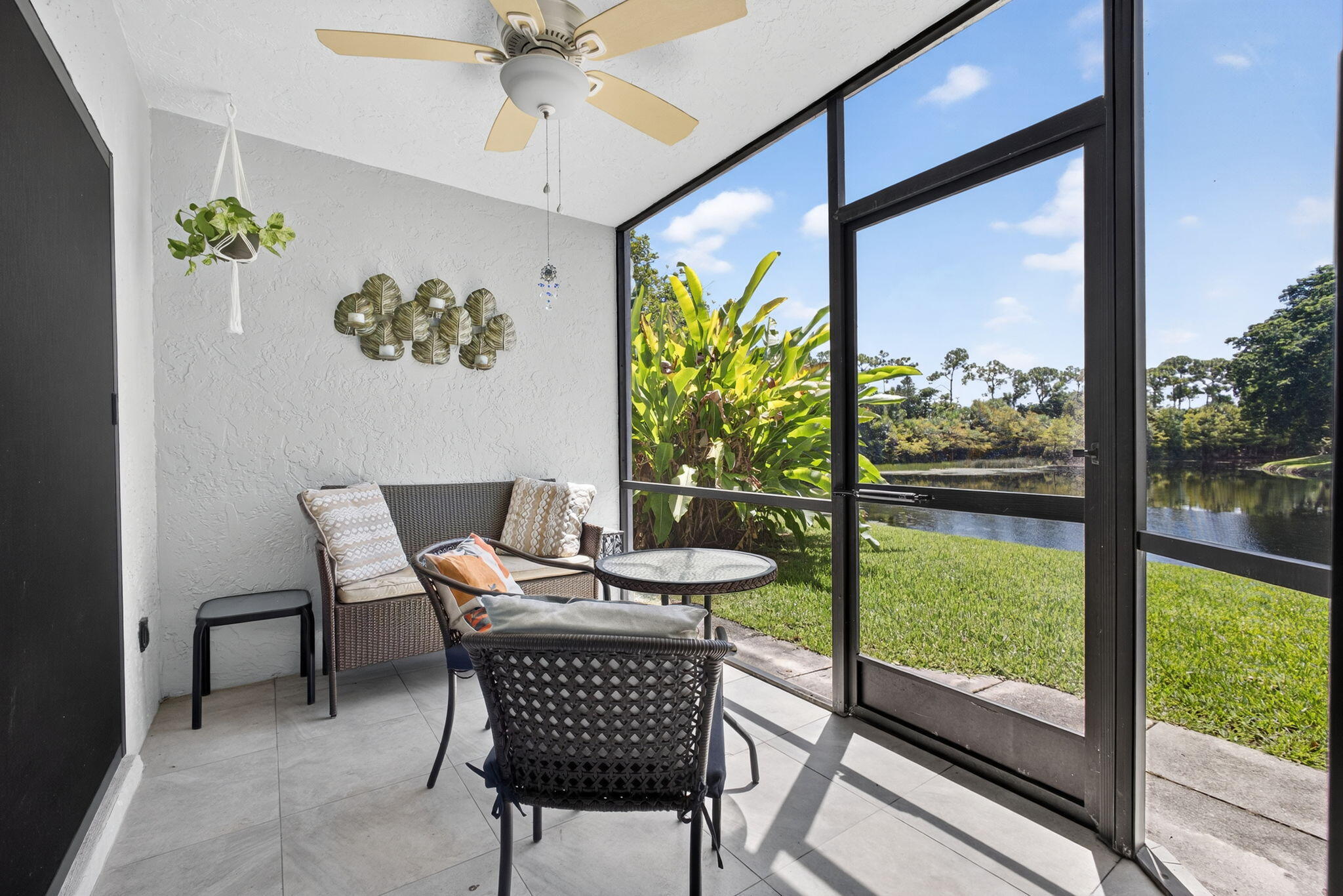 406 Harbour Pointe Way Greenacres, FL 33413 - Photo 46 of 79 a view of a dining room with furniture a chandelier and wooden floor