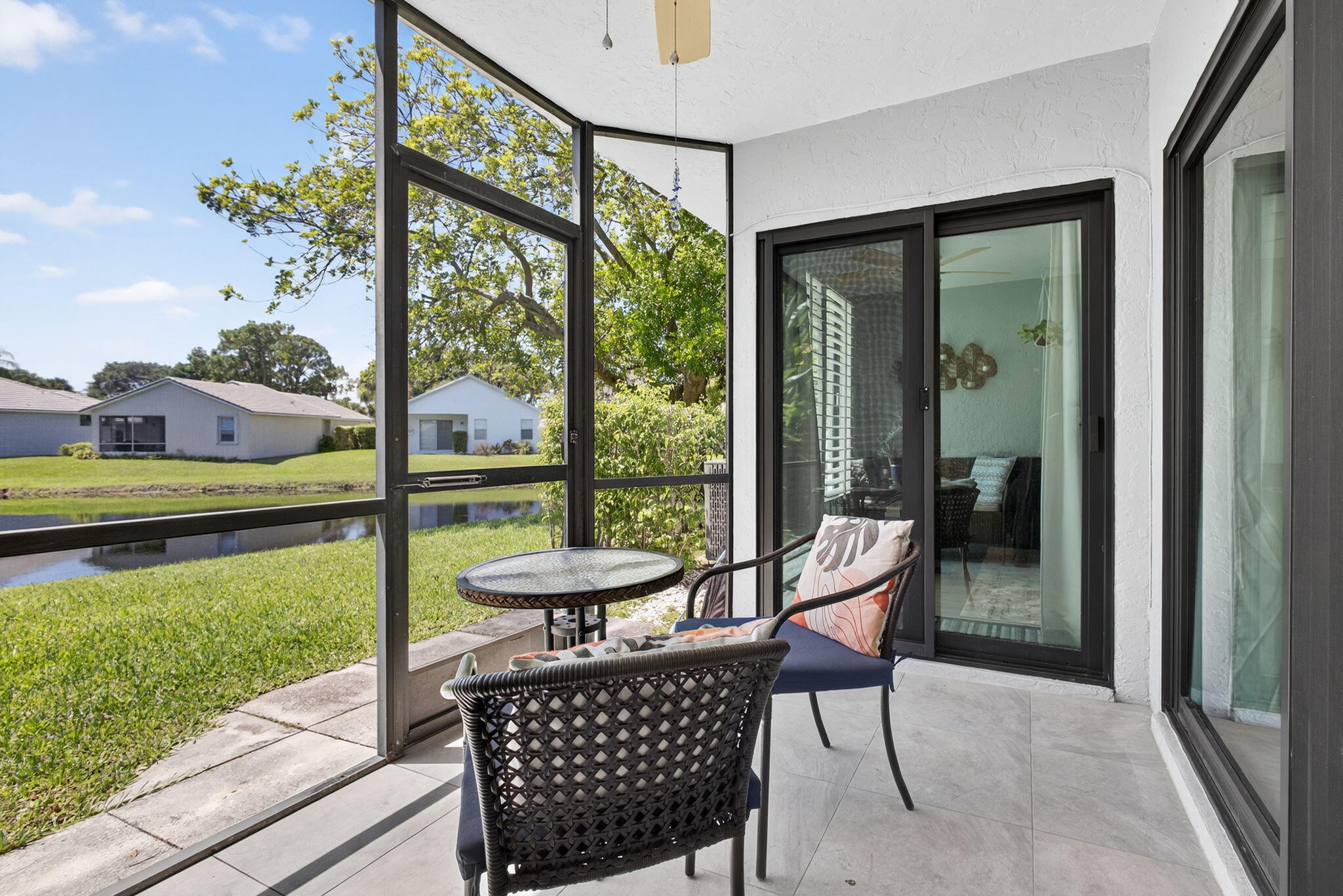 406 Harbour Pointe Way Greenacres, FL 33413 - Photo 48 of 79 a view of a porch with furniture and wooden floor