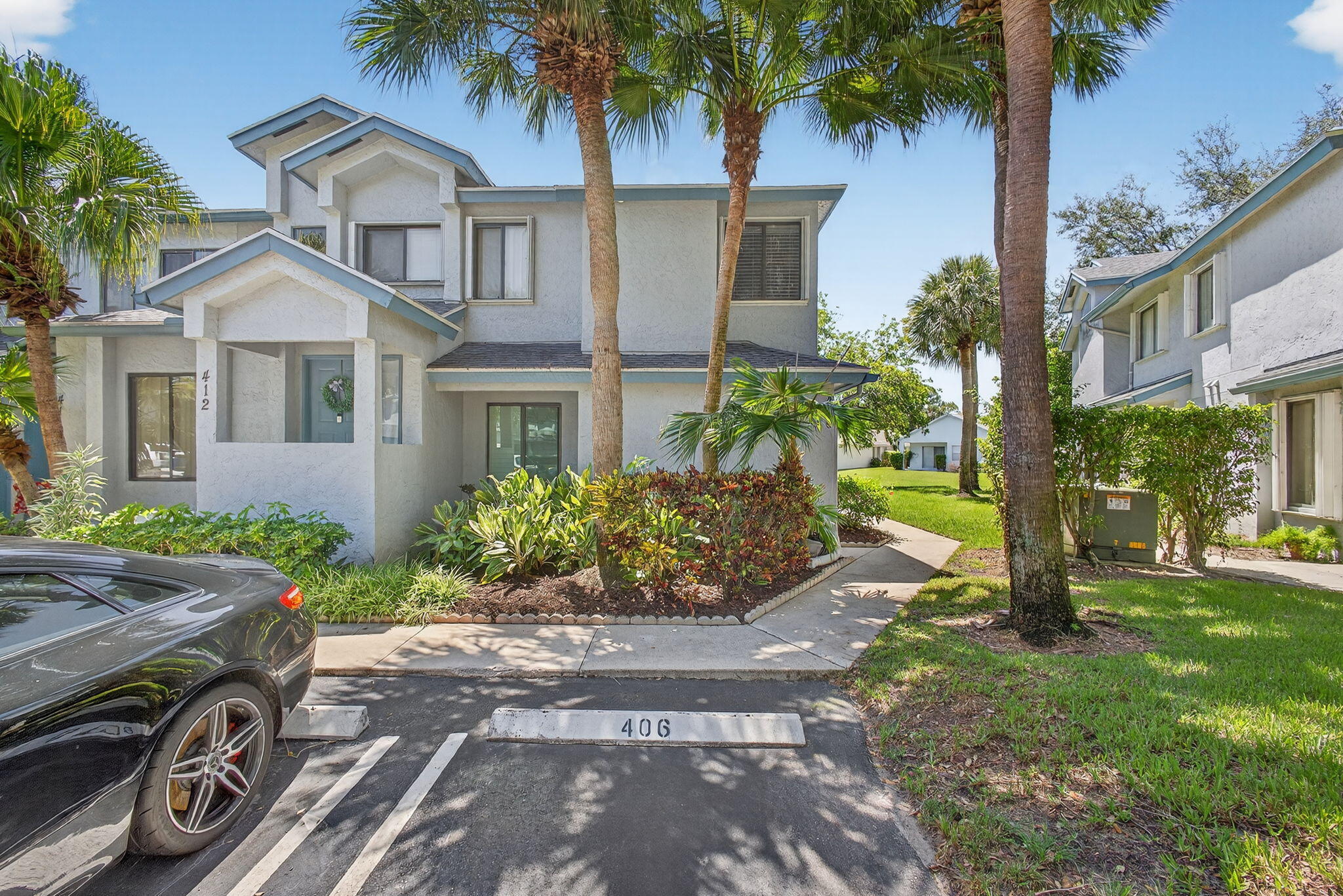 406 Harbour Pointe Way Greenacres, FL 33413 - Photo 5 of 79 a front view of a house with garden