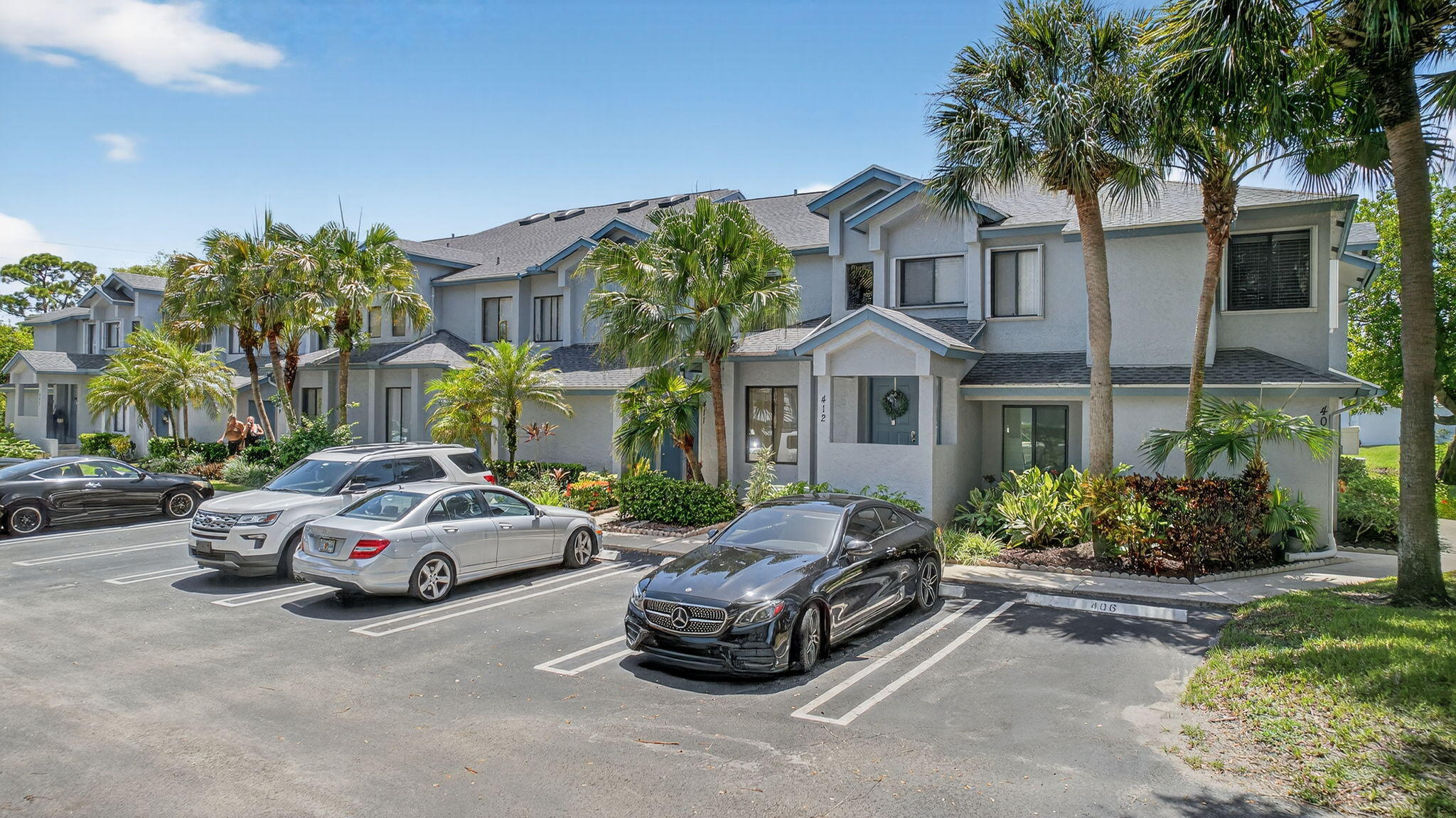 406 Harbour Pointe Way Greenacres, FL 33413 - Photo 58 of 79 a car parked in front of a white house