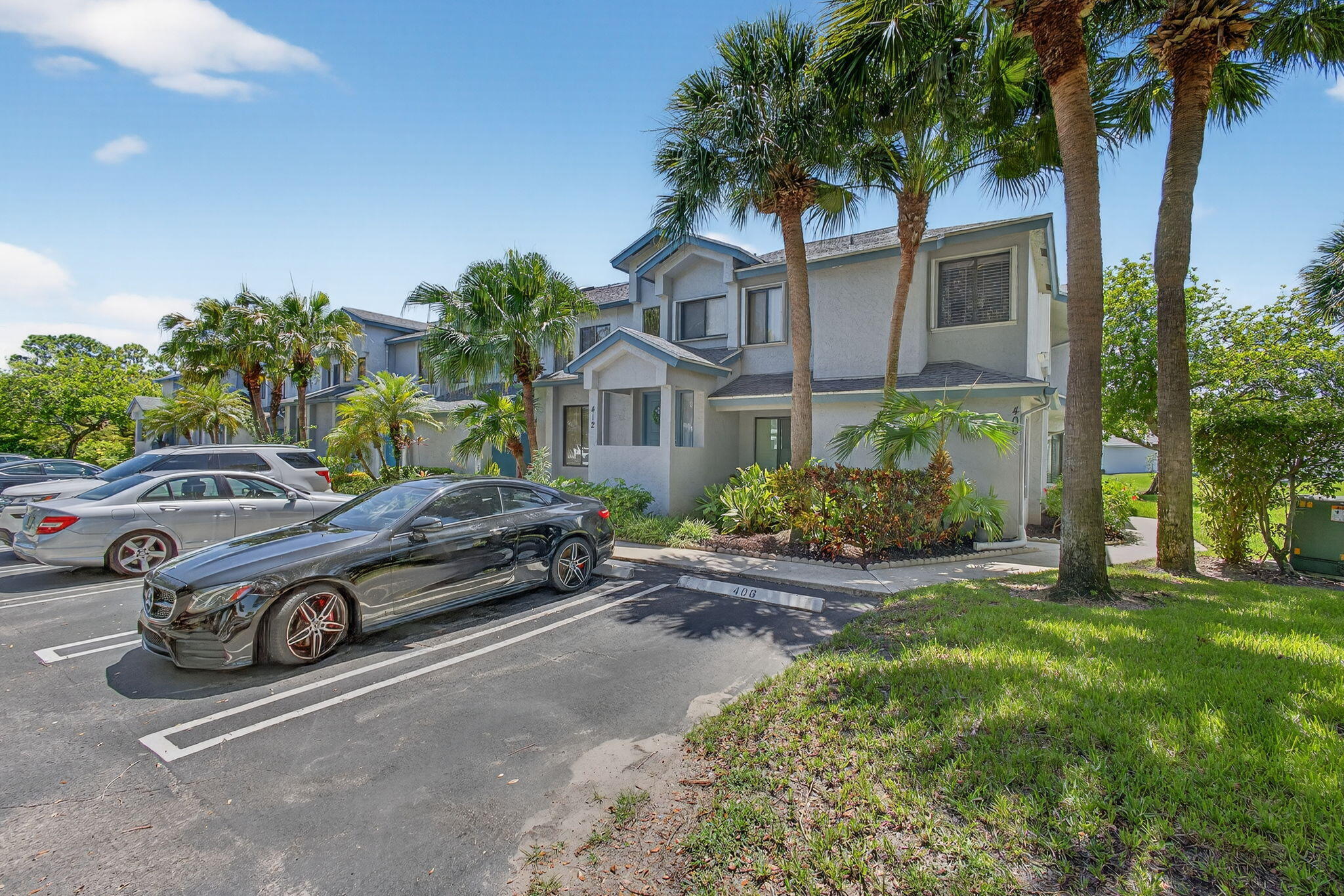 406 Harbour Pointe Way Greenacres, FL 33413 - Photo 6 of 79 a car parked in front of a house