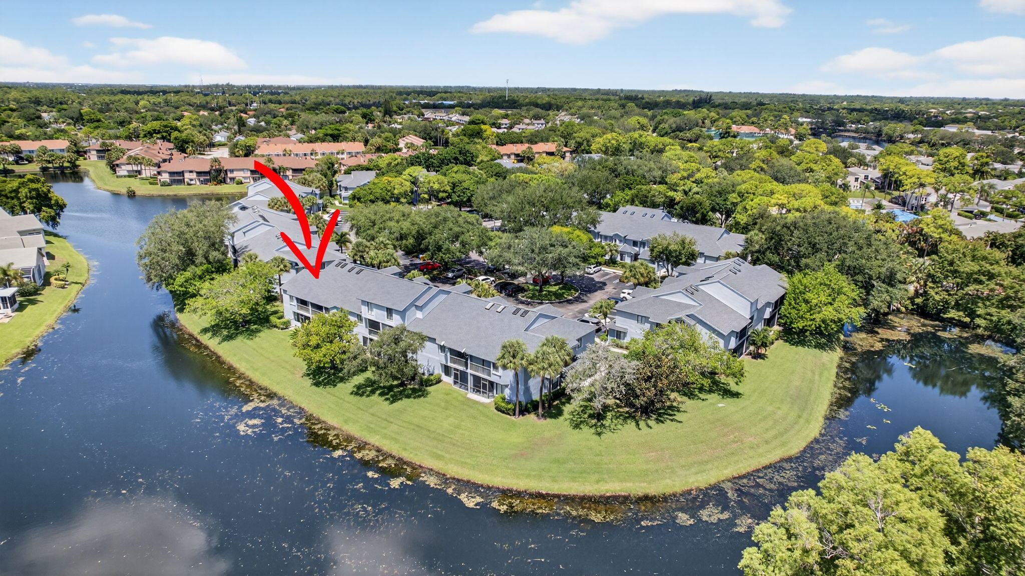 406 Harbour Pointe Way Greenacres, FL 33413 - Photo 64 of 79 an aerial view of a house with a yard and lake view
