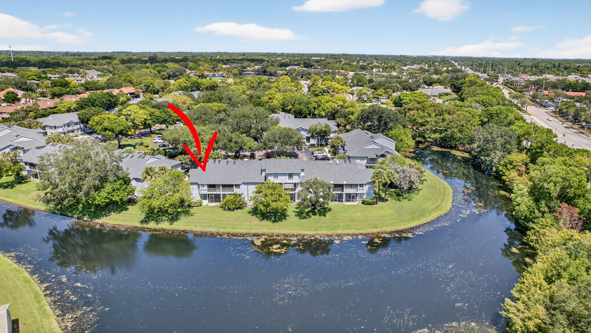 406 Harbour Pointe Way Greenacres, FL 33413 - Photo 65 of 79 an aerial view of a house with a yard and lake view