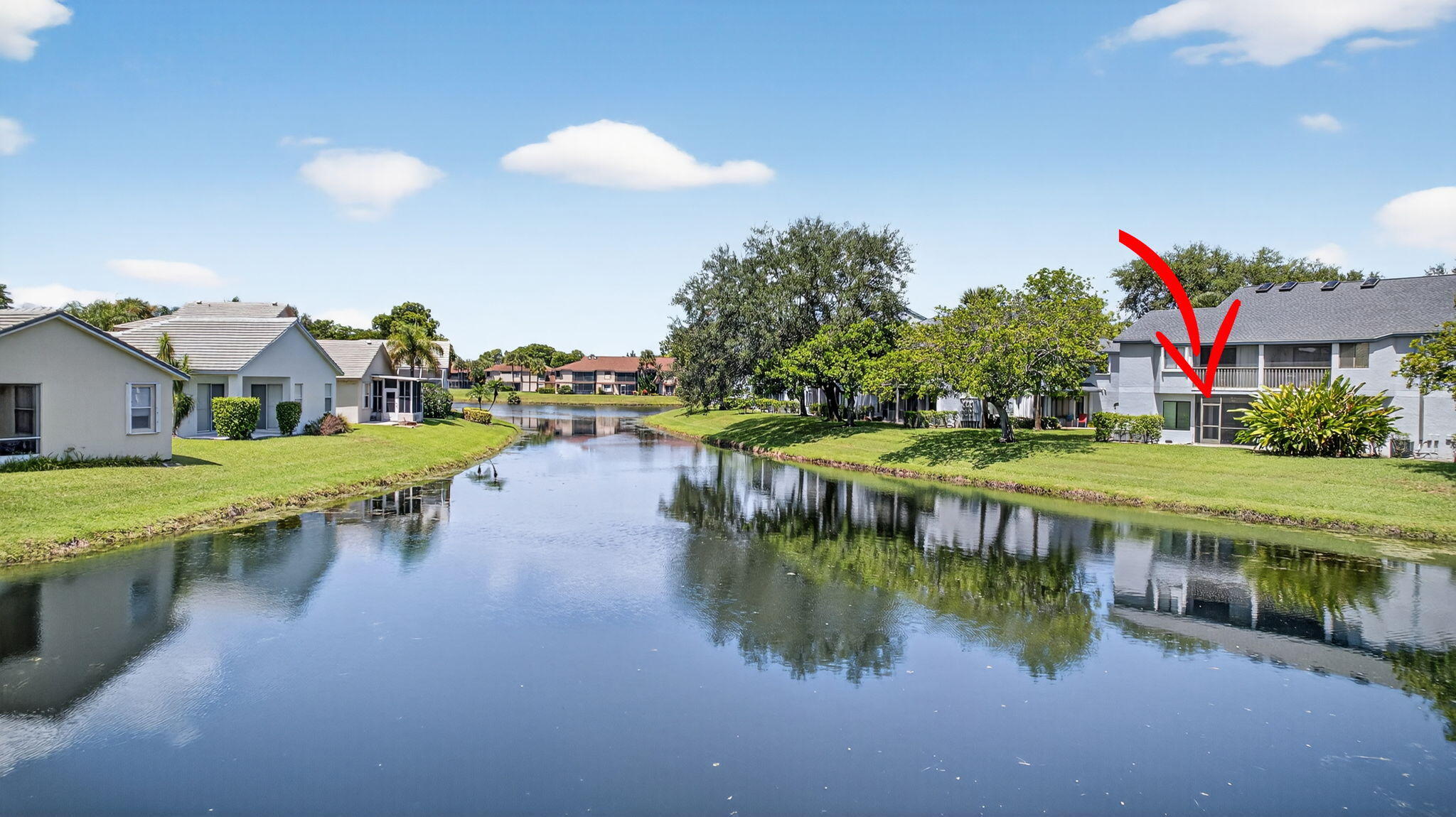 406 Harbour Pointe Way Greenacres, FL 33413 - Photo 72 of 79 a view of a lake with a house swimming pool and outdoor space