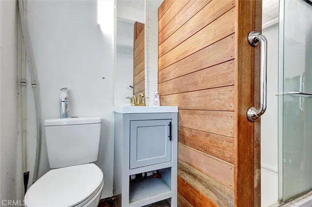 a bedroom with a bed and cabinets