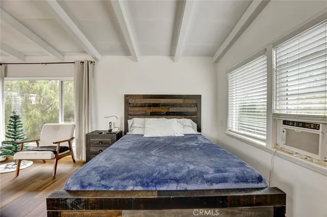 a bathroom with a granite countertop toilet sink and mirror