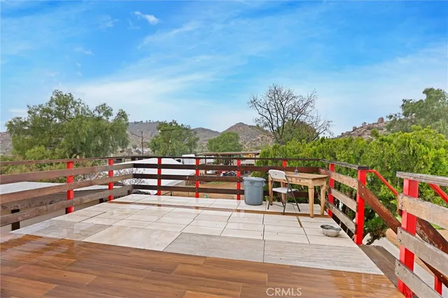 a bedroom with furniture and a chandelier