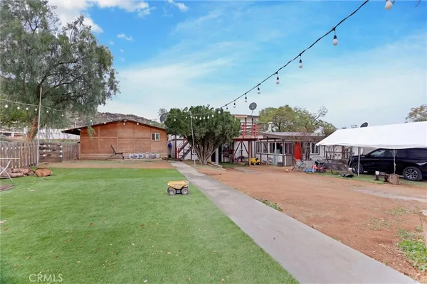 a outdoor space with lots of furniture and wooden floors