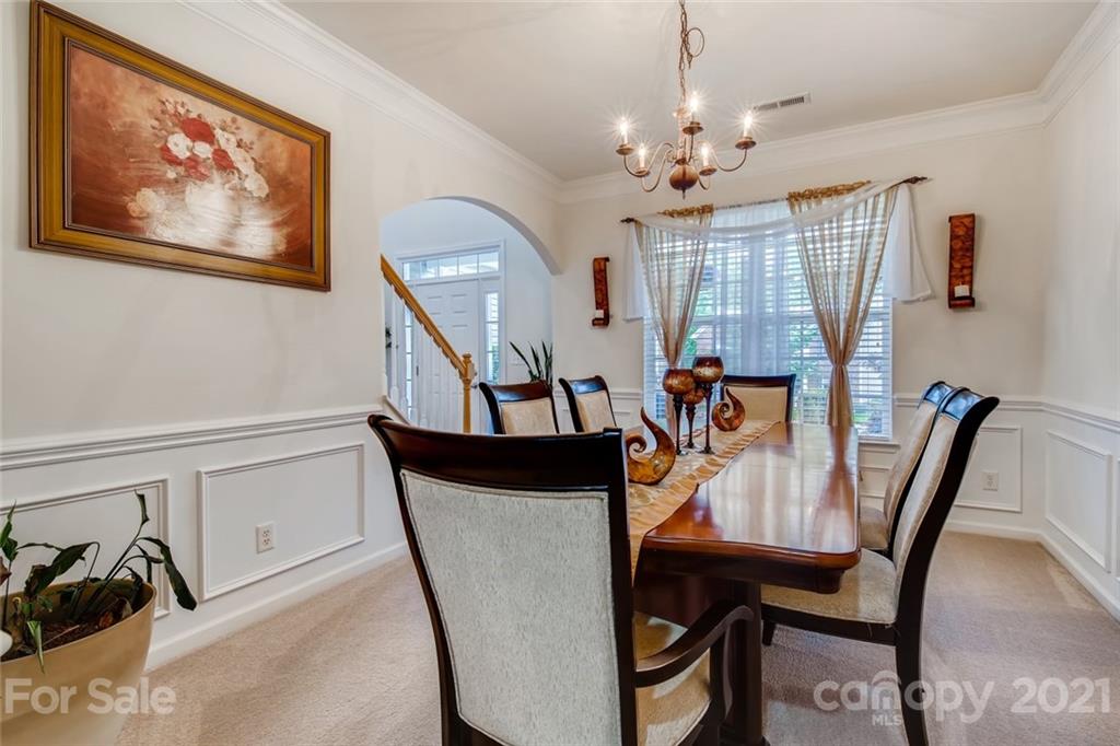 7643 West Berkeley Road Denver, NC 28037 - Photo 8 of 28 a view of a dining room with furniture and chandelier