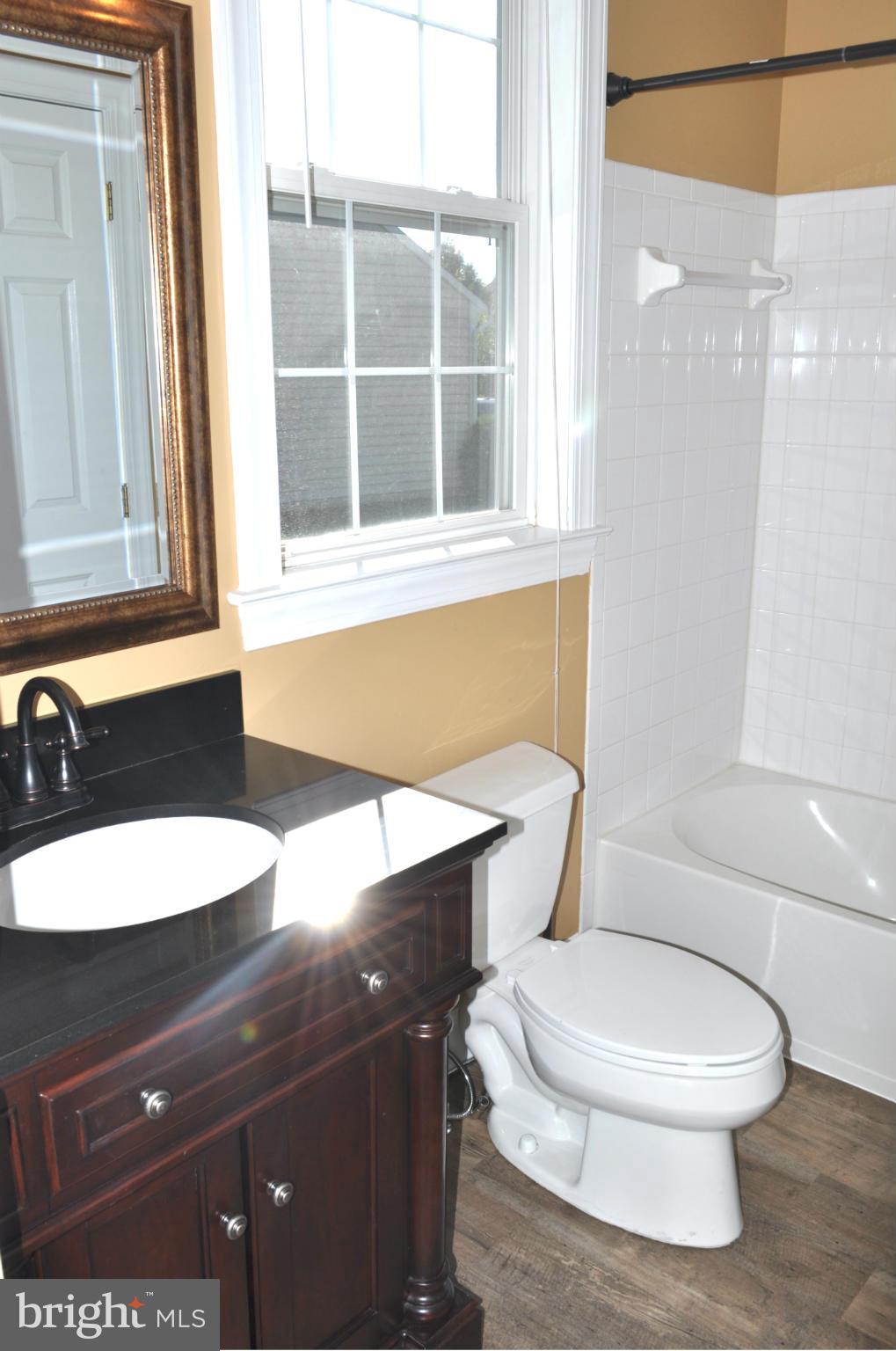 3907 Pender Spring Drive Fairfax, VA 22033 - Photo 11 of 30 a bathroom with a toilet a sink and a mirror