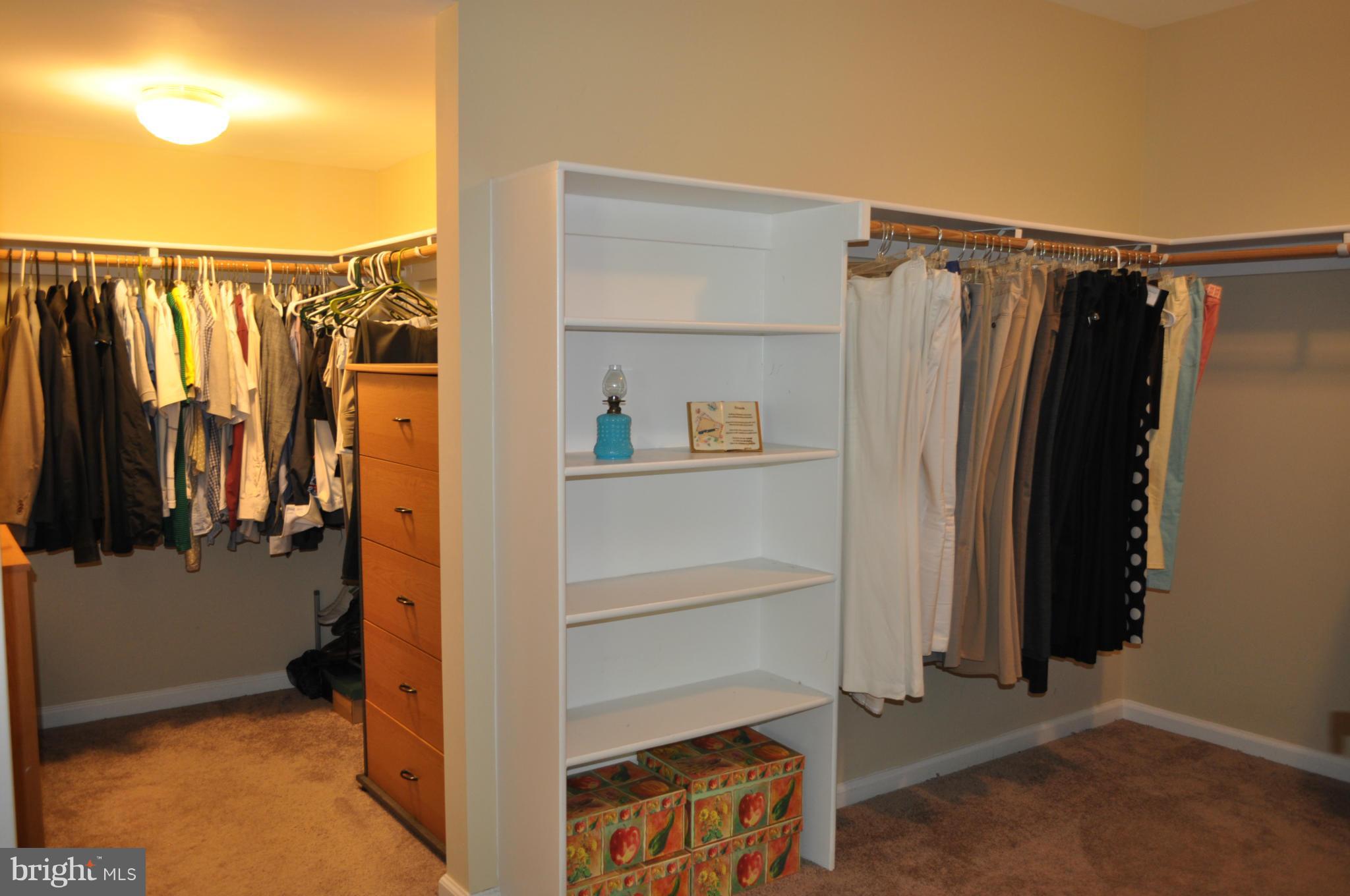 3907 Pender Spring Drive Fairfax, VA 22033 - Photo 16 of 30 a view of walk in closet with clothes and shoes