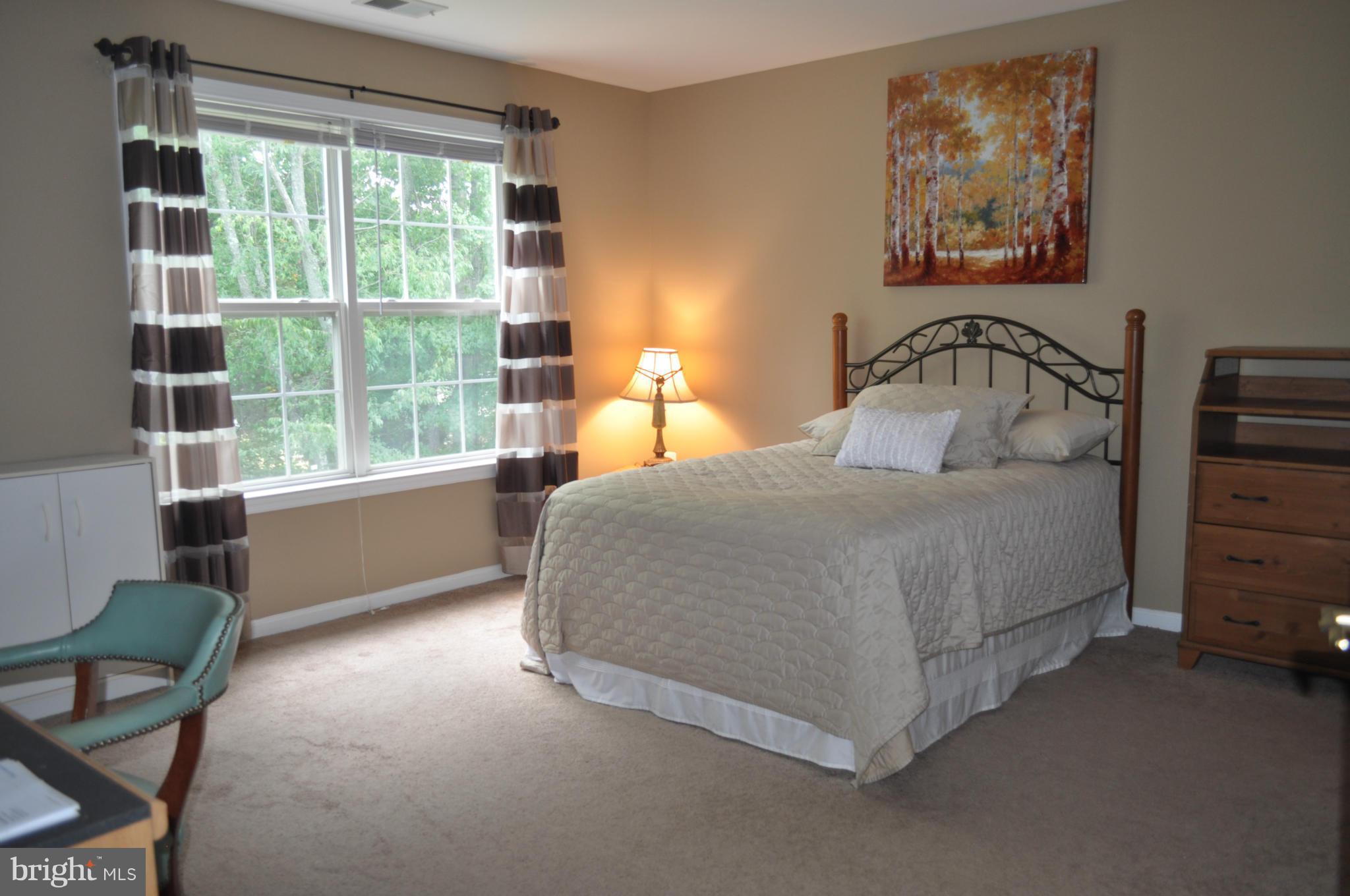 3907 Pender Spring Drive Fairfax, VA 22033 - Photo 19 of 30 a bedroom with a bed and a large window