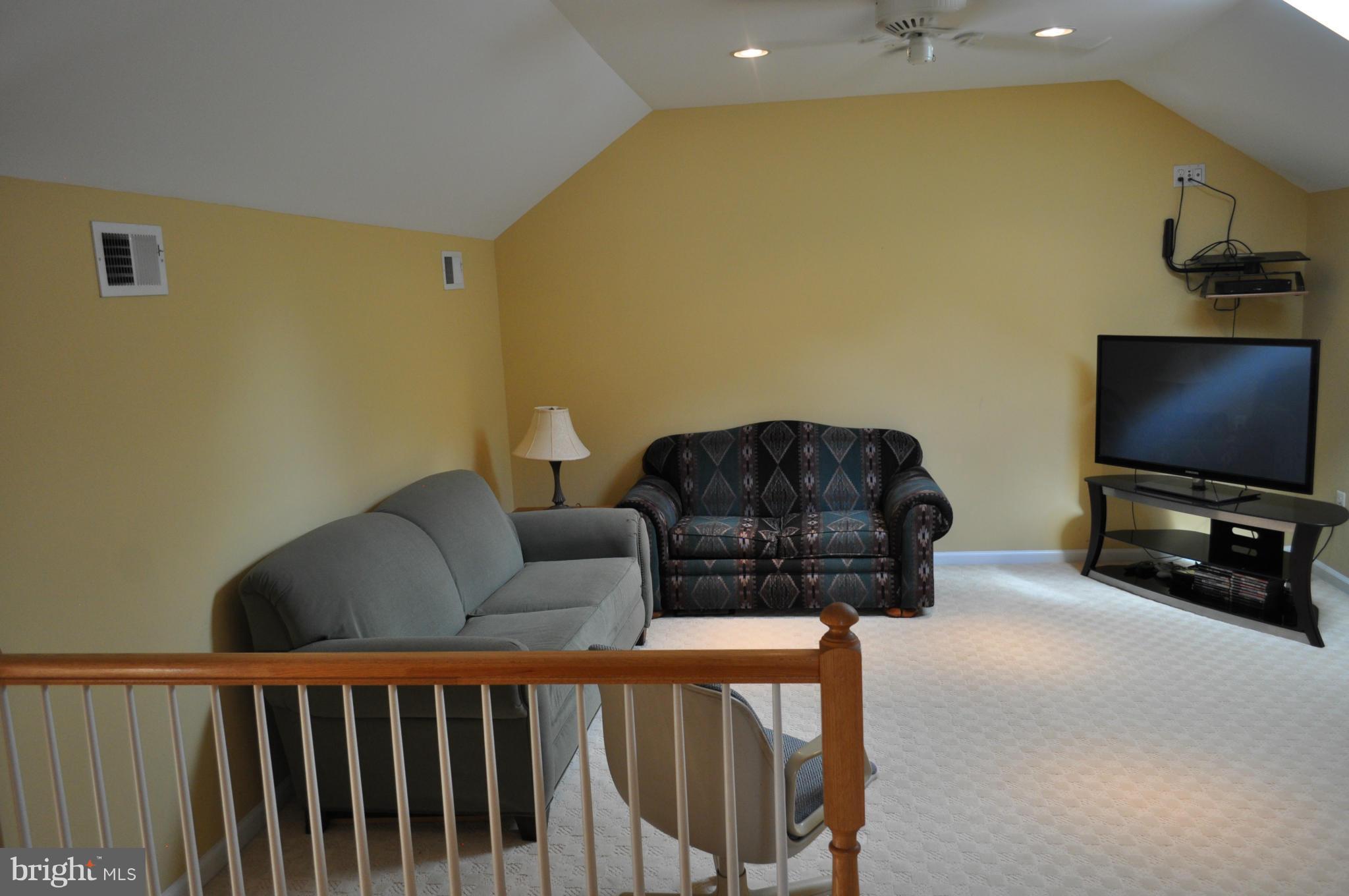 3907 Pender Spring Drive Fairfax, VA 22033 - Photo 25 of 30 a living room with furniture and a flat screen tv