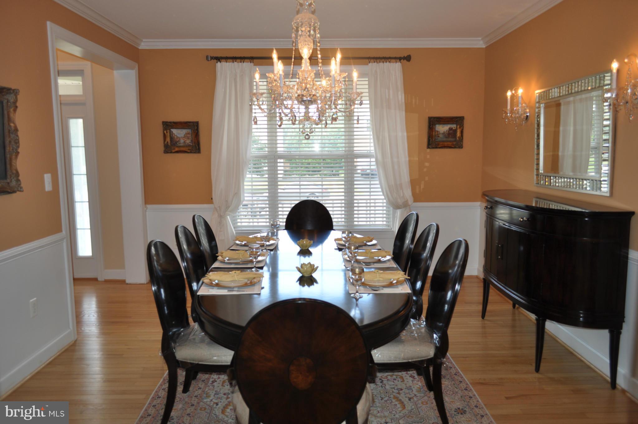3907 Pender Spring Drive Fairfax, VA 22033 - Photo 4 of 30 a view of a dining room with furniture and chandelier