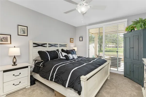 a bed room with bed and a window