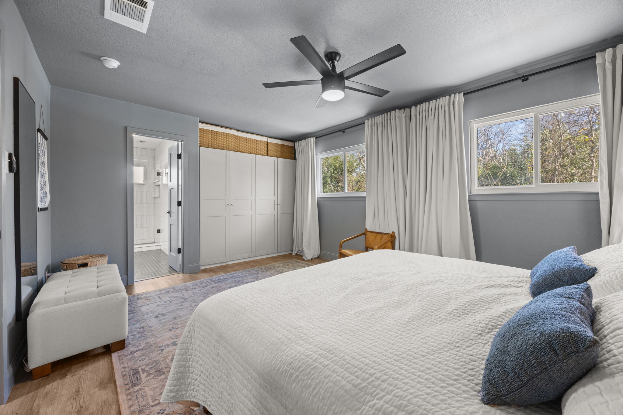 8401 Alabama Drive Austin, TX 78745 - Photo 11 of 23 a bedroom with a large bed and a window