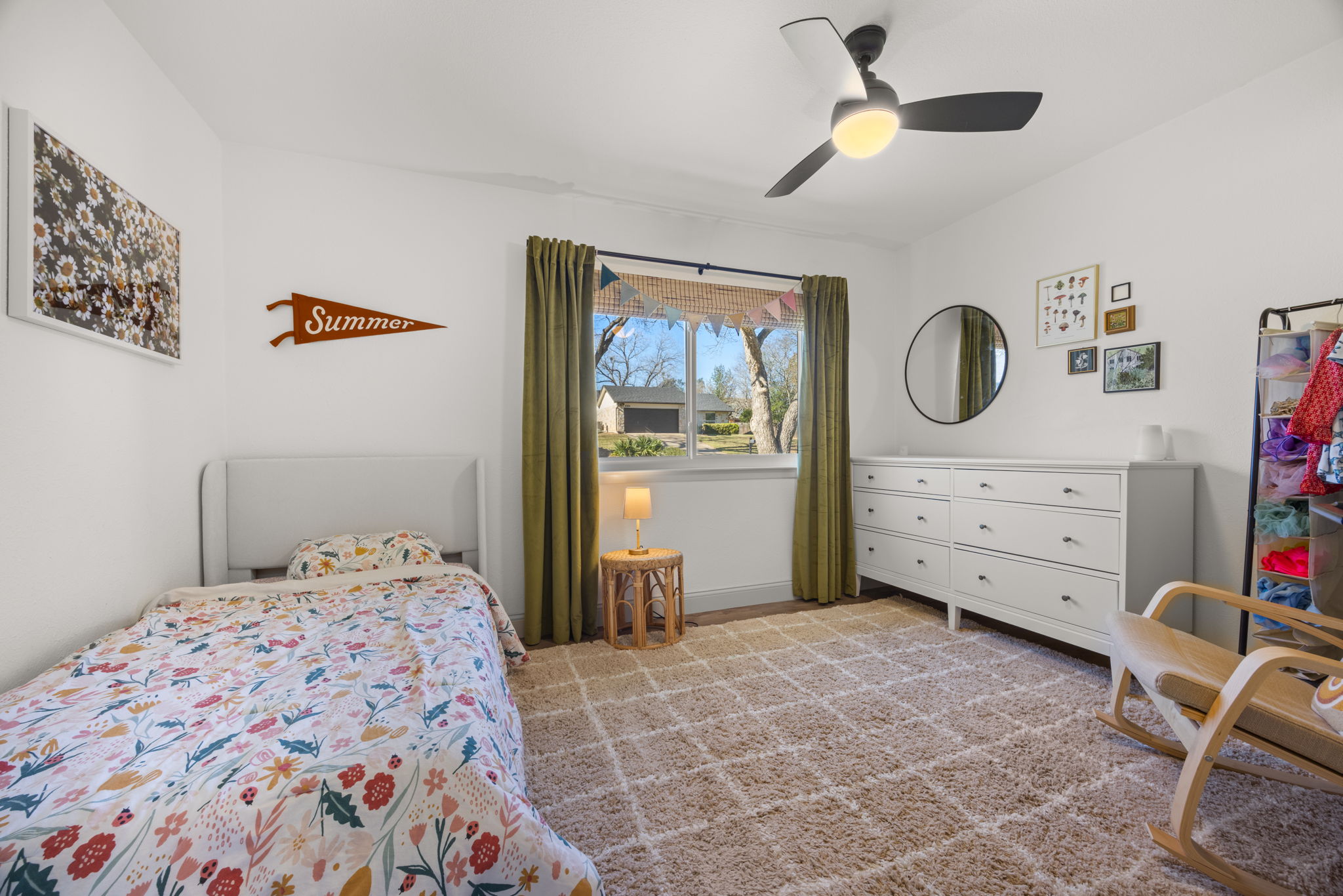 8401 Alabama Drive Austin, TX 78745 - Photo 14 of 23 a bedroom with a bed and a dresser in it