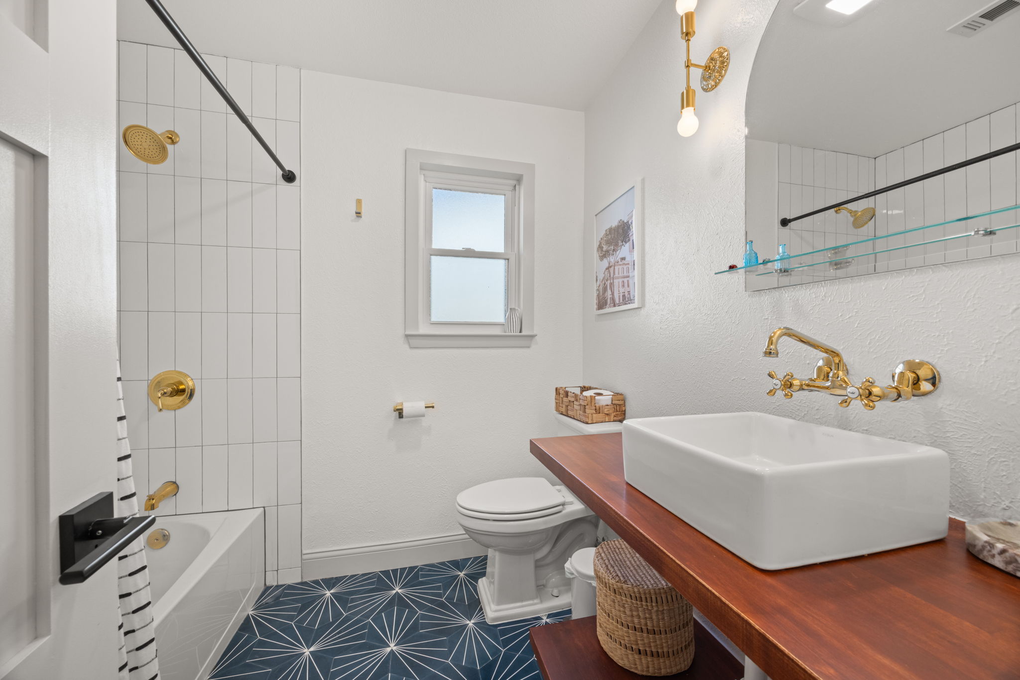 8401 Alabama Drive Austin, TX 78745 - Photo 15 of 23 a bathroom with a sink toilet and shower