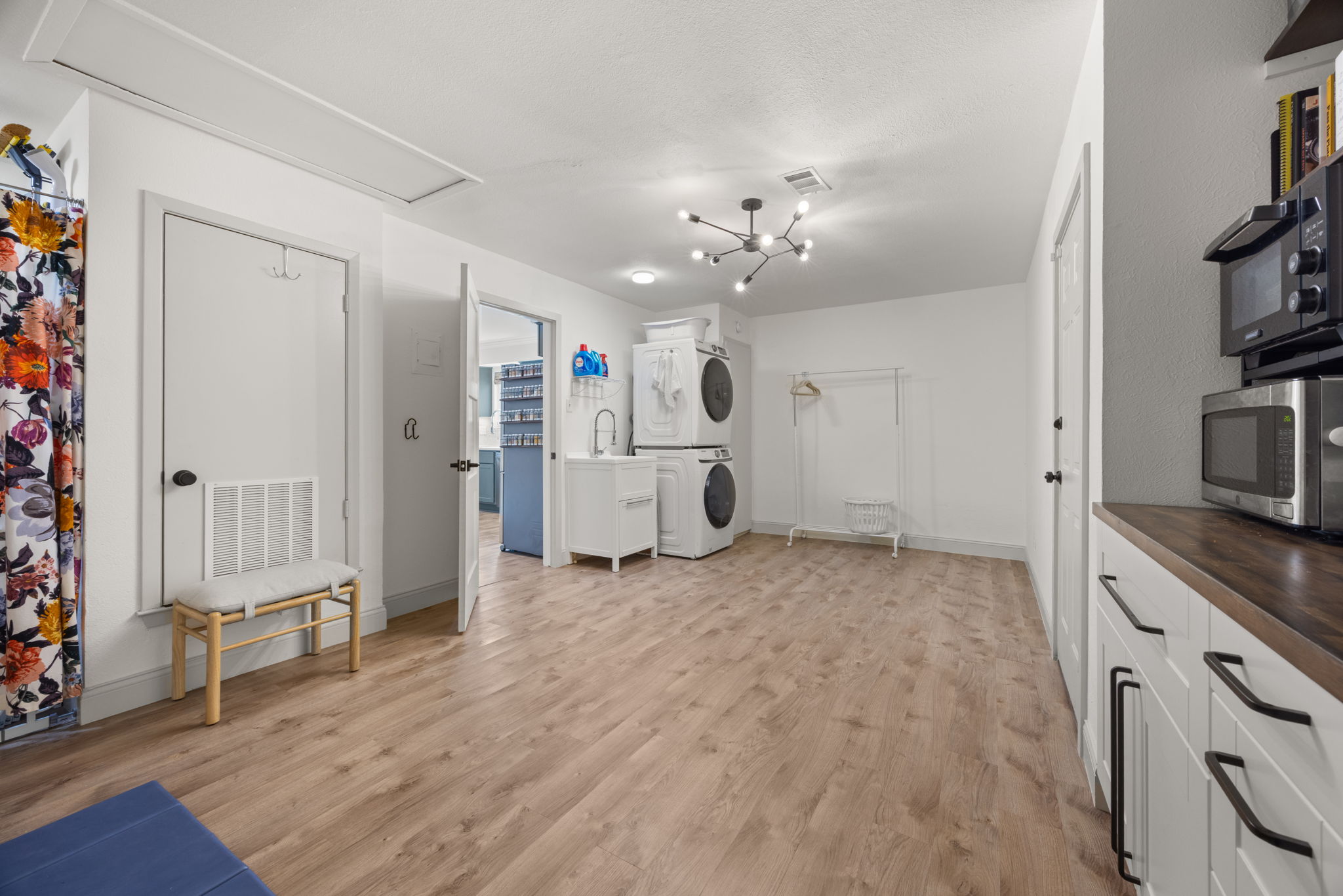 8401 Alabama Drive Austin, TX 78745 - Photo 17 of 23 a view of a kitchen with fridge and wooden floor