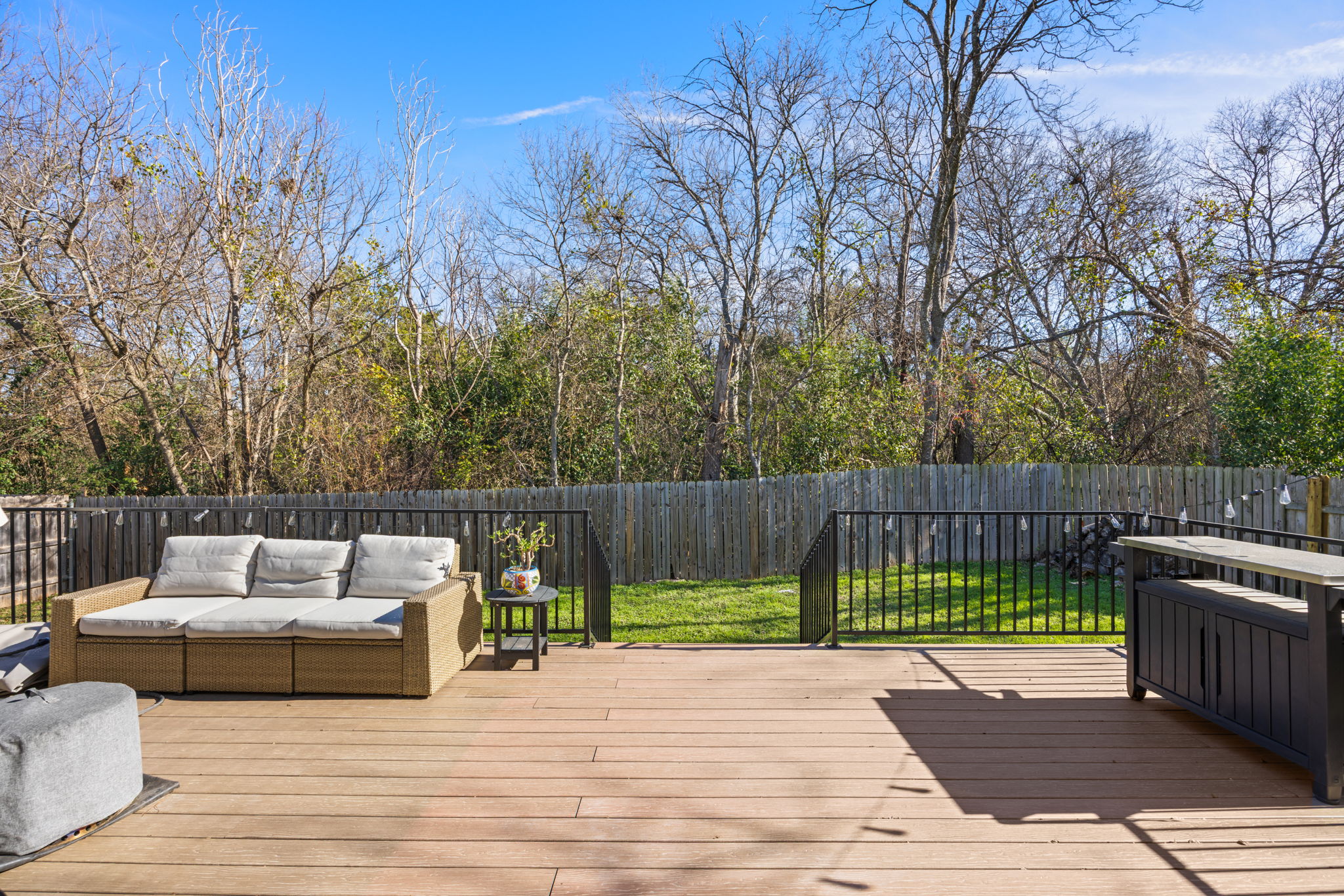 8401 Alabama Drive Austin, TX 78745 - Photo 19 of 23 a view of a deck with couches and wooden fence