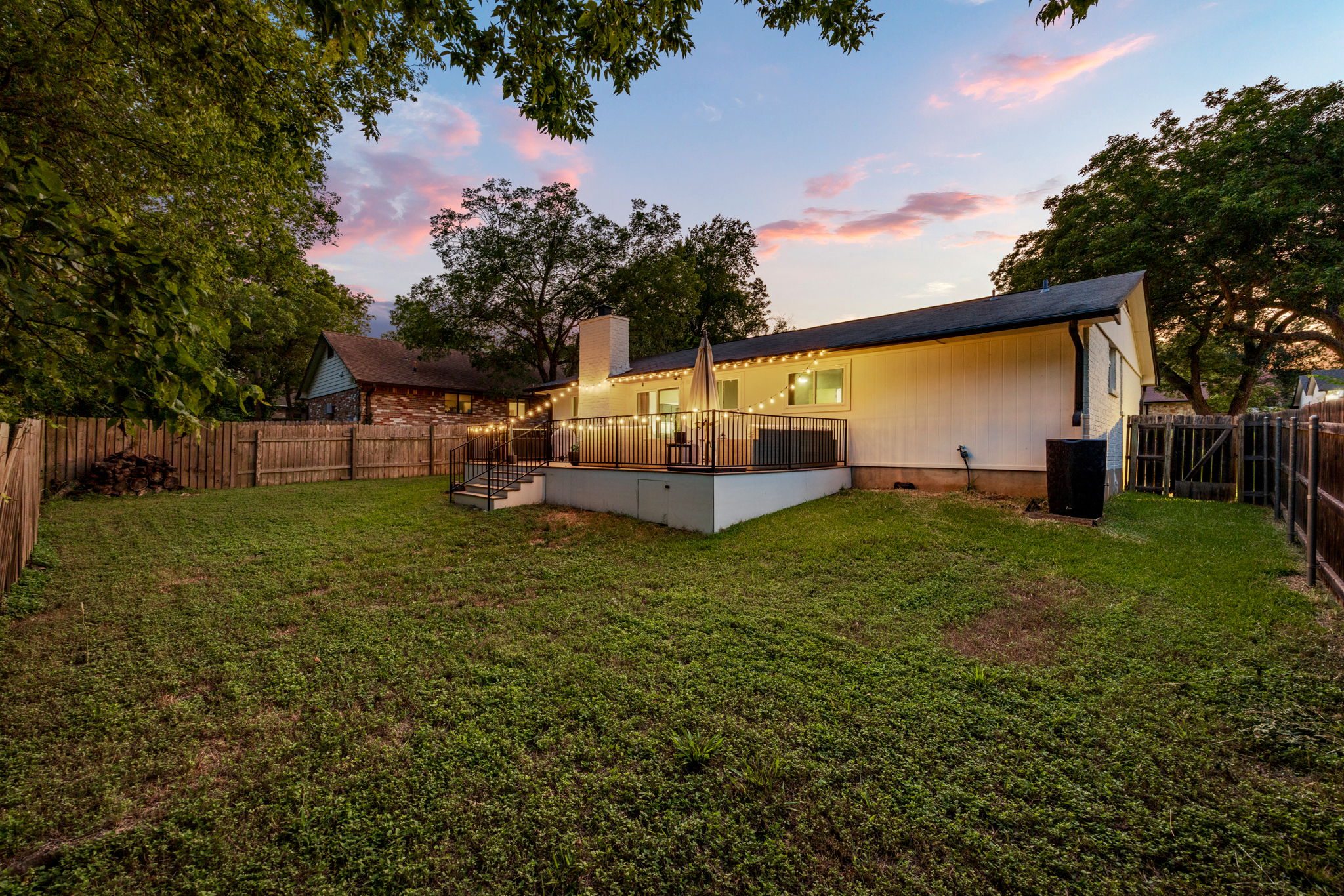 8401 Alabama Drive Austin, TX 78745 - Photo 20 of 23 a backyard of a house with lots of green space