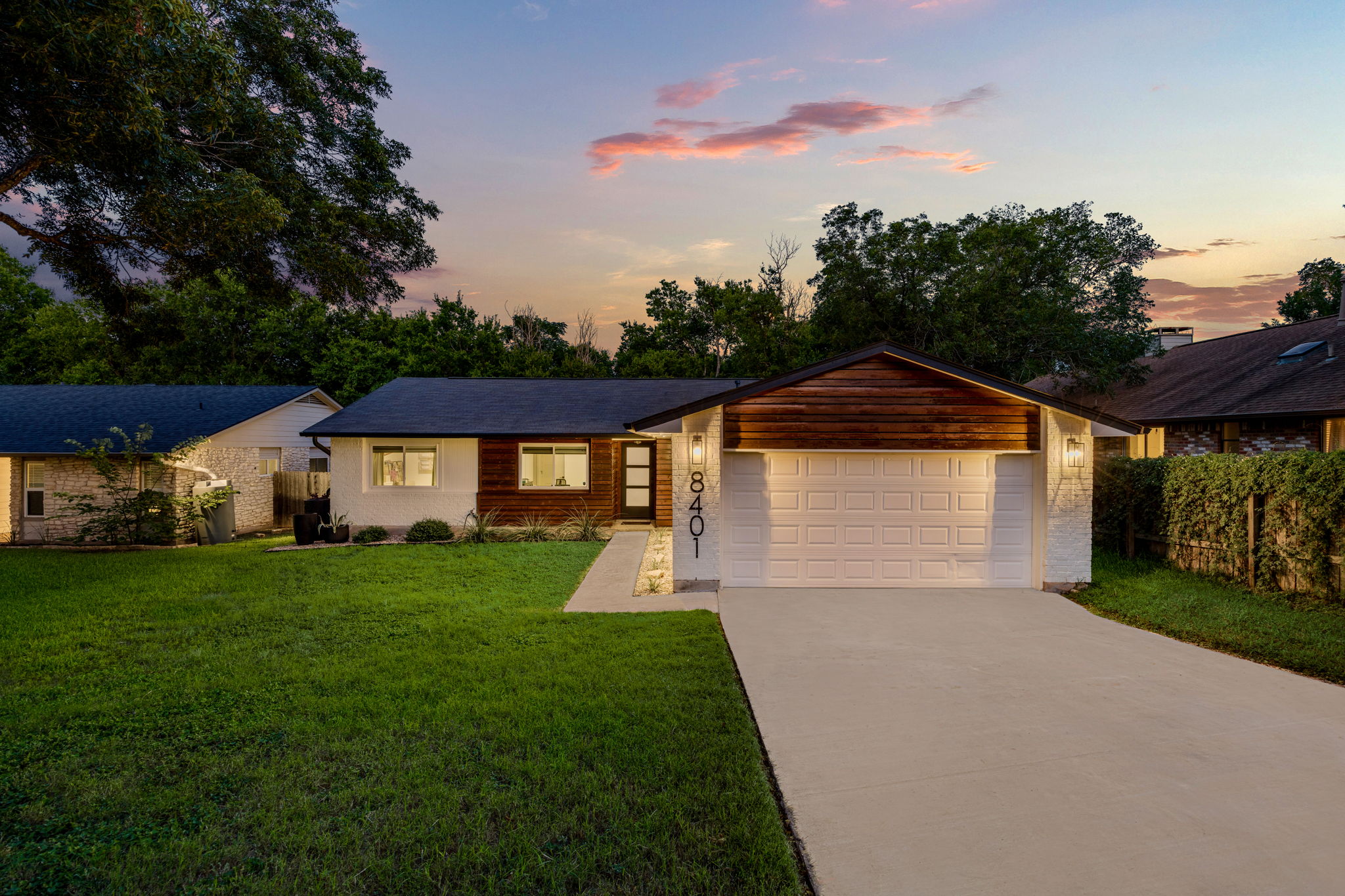8401 Alabama Drive Austin, TX 78745 - Photo 23 of 23 a front view of a house with a yard and garage