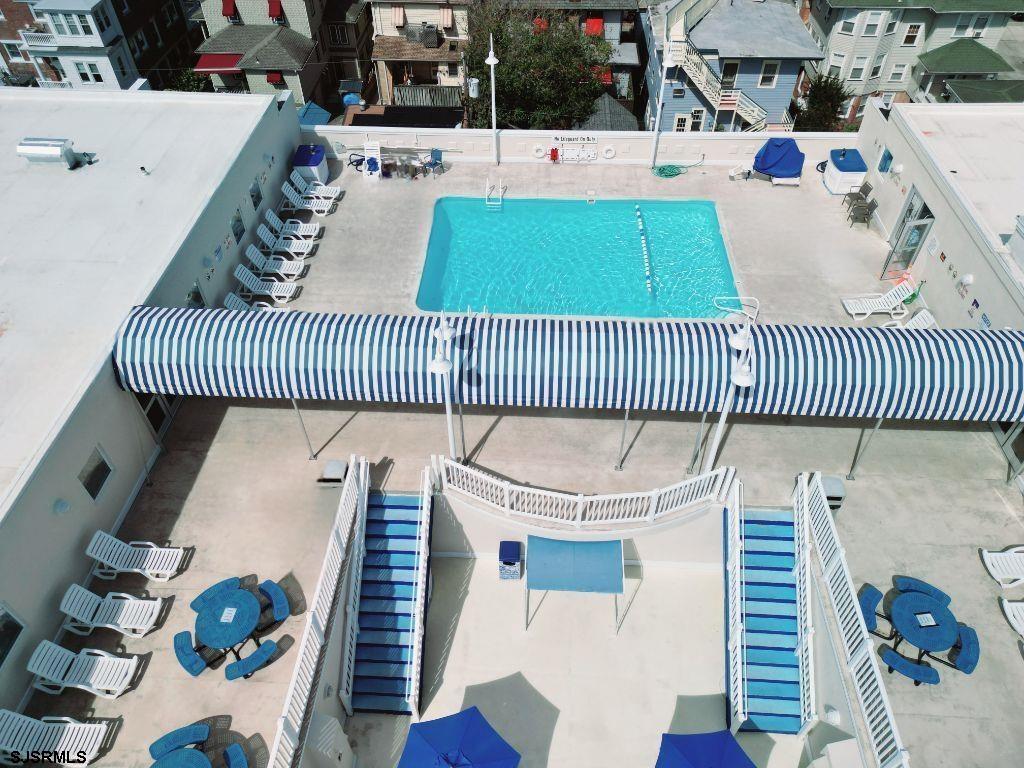 820 Ocean Avenue, Unit 115 Ocean City, NJ 08226 - Photo 13 of 58 a view of a patio filled with furniture