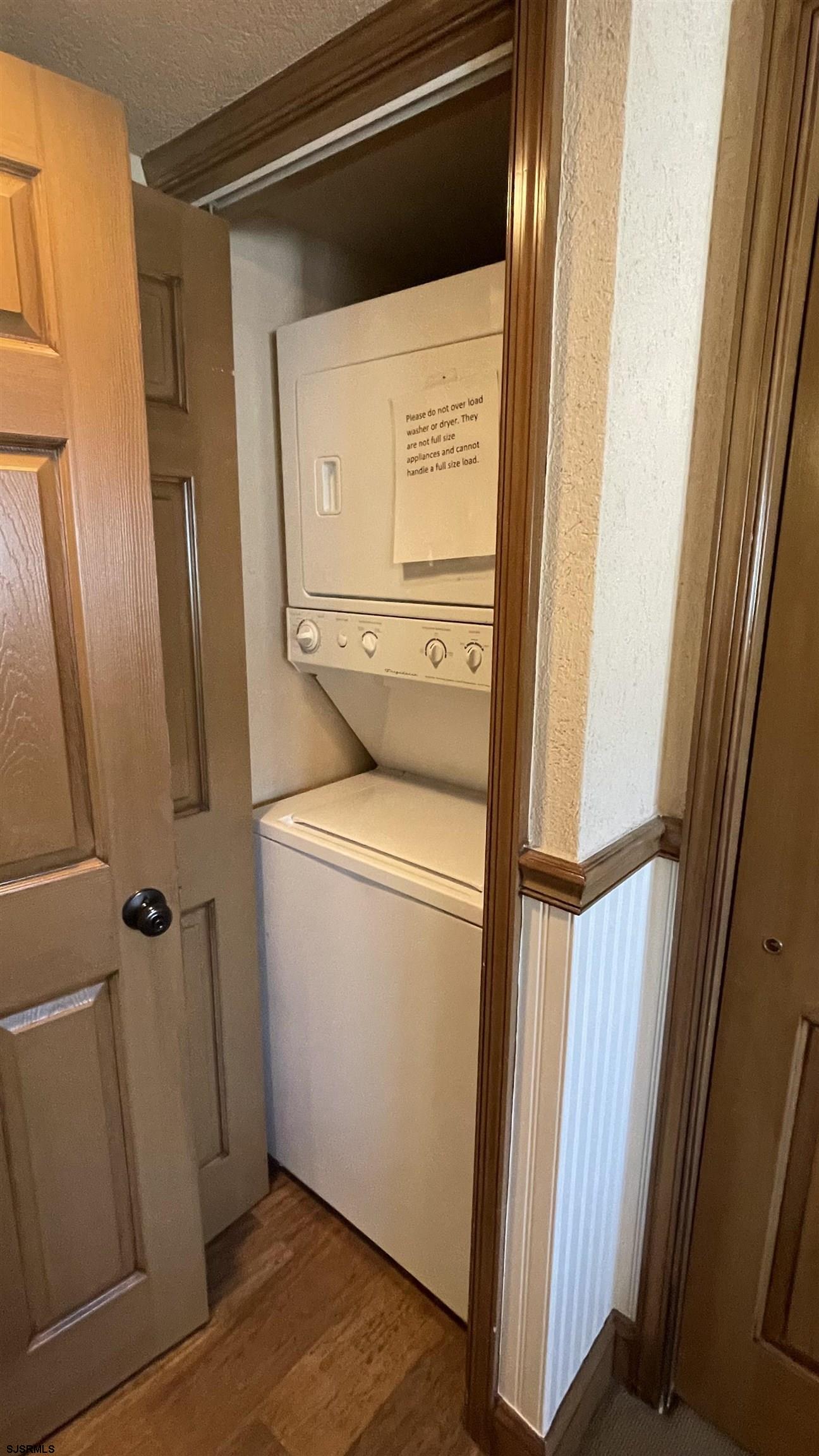820 Ocean Avenue, Unit 115 Ocean City, NJ 08226 - Photo 28 of 58 a utility room with dryer and washer