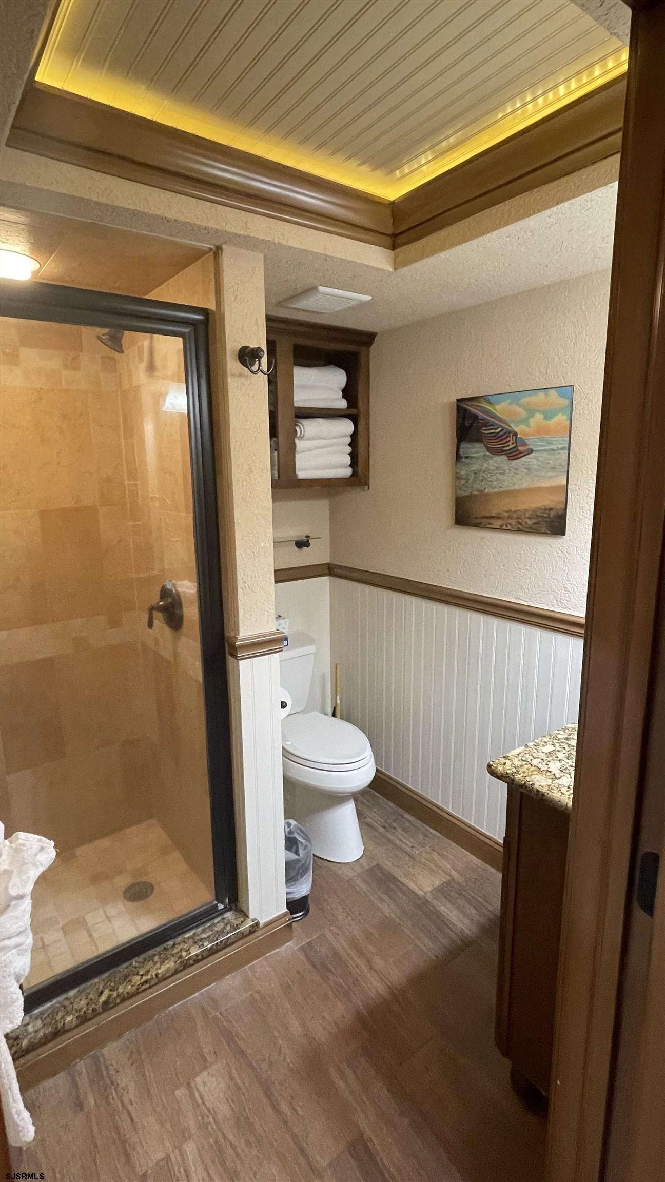 820 Ocean Avenue, Unit 115 Ocean City, NJ 08226 - Photo 30 of 58 a bathroom with a toilet and a shower