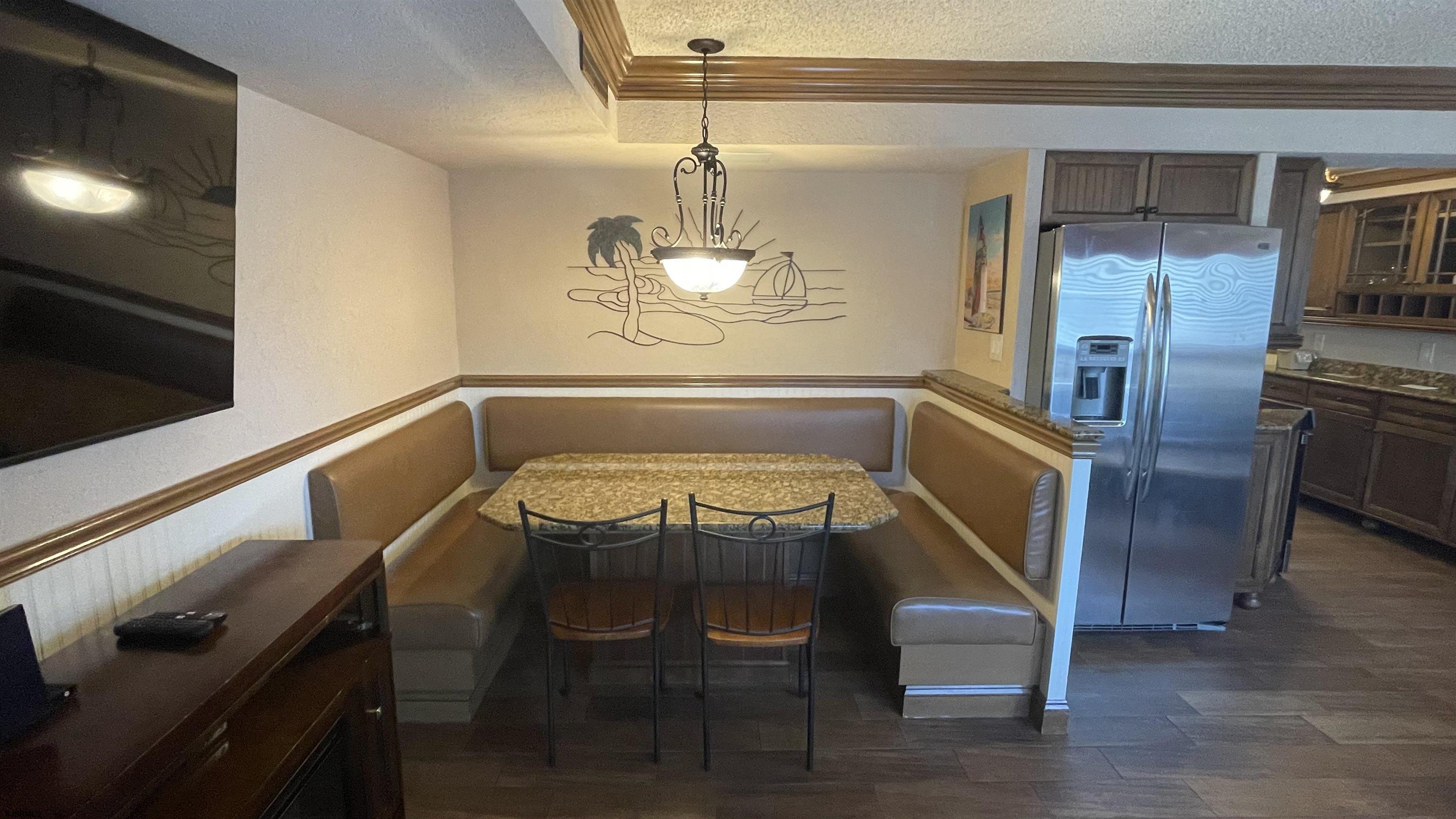 820 Ocean Avenue, Unit 115 Ocean City, NJ 08226 - Photo 36 of 58 a view of a room with wooden floor and staircase