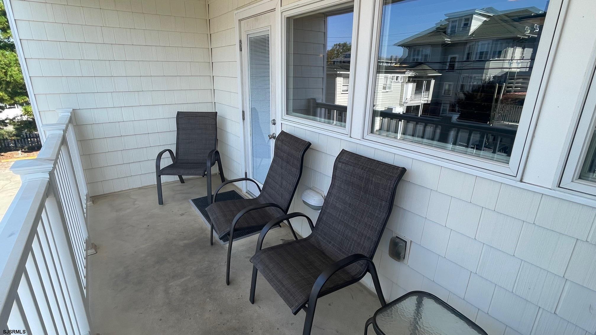 820 Ocean Avenue, Unit 115 Ocean City, NJ 08226 - Photo 53 of 58 a view of a outdoor seating area with furniture