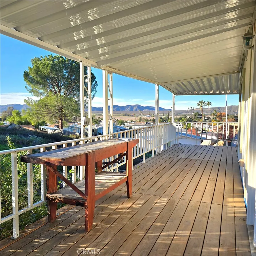 1536 South State Street, Unit 219 Hemet, CA 92543 - Photo 4 of 23 Back side of deck with french door entry into living room.