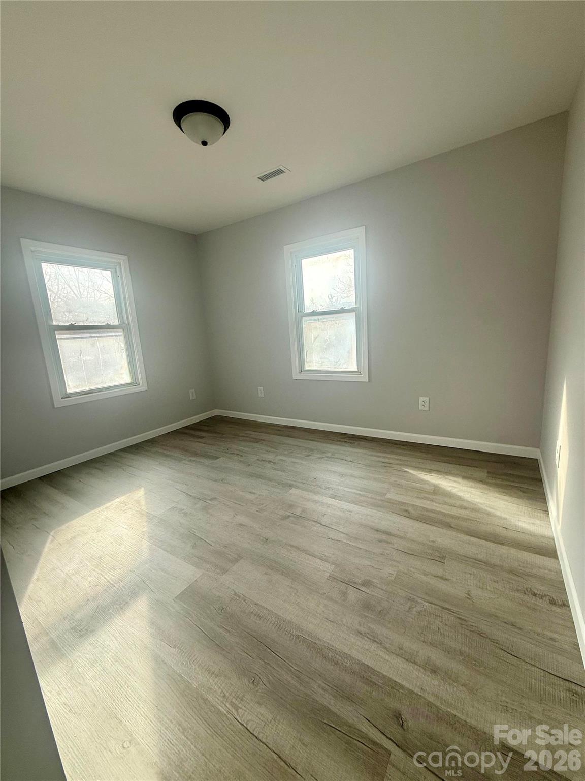 6457 Hudlow Road Union Mills, NC 28167 - Photo 11 of 14 wooden floor in an empty room with a window
