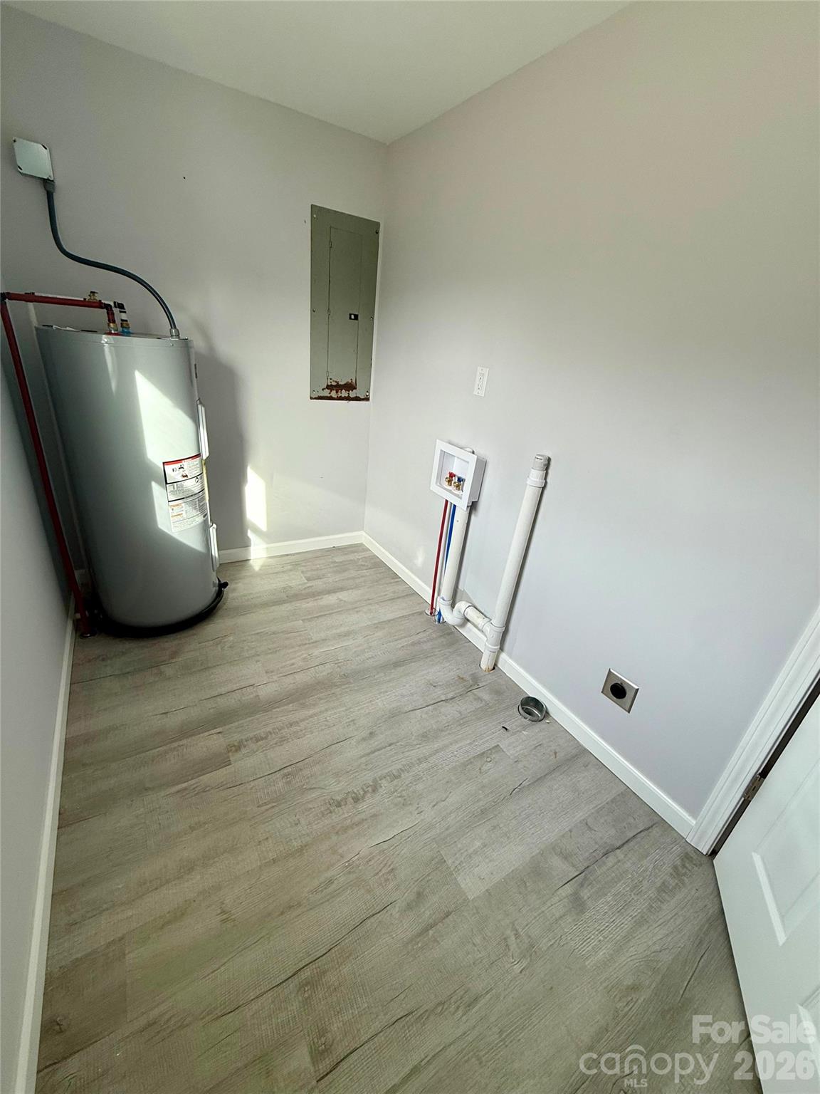 6457 Hudlow Road Union Mills, NC 28167 - Photo 13 of 14 a view of a livingroom with wooden floor and a window