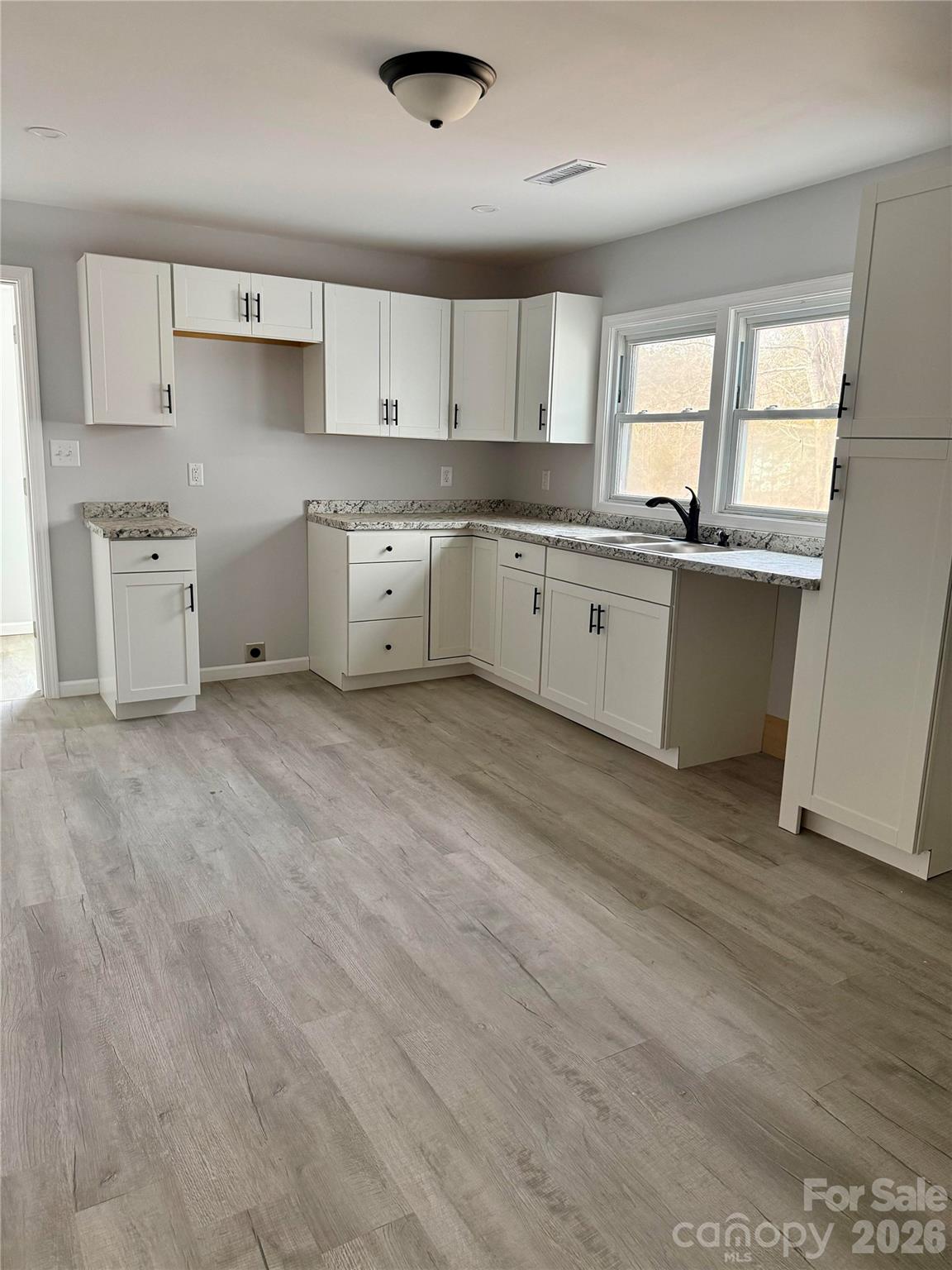 6457 Hudlow Road Union Mills, NC 28167 - Photo 5 of 14 a large kitchen with a stove a sink dishwasher and a refrigerator