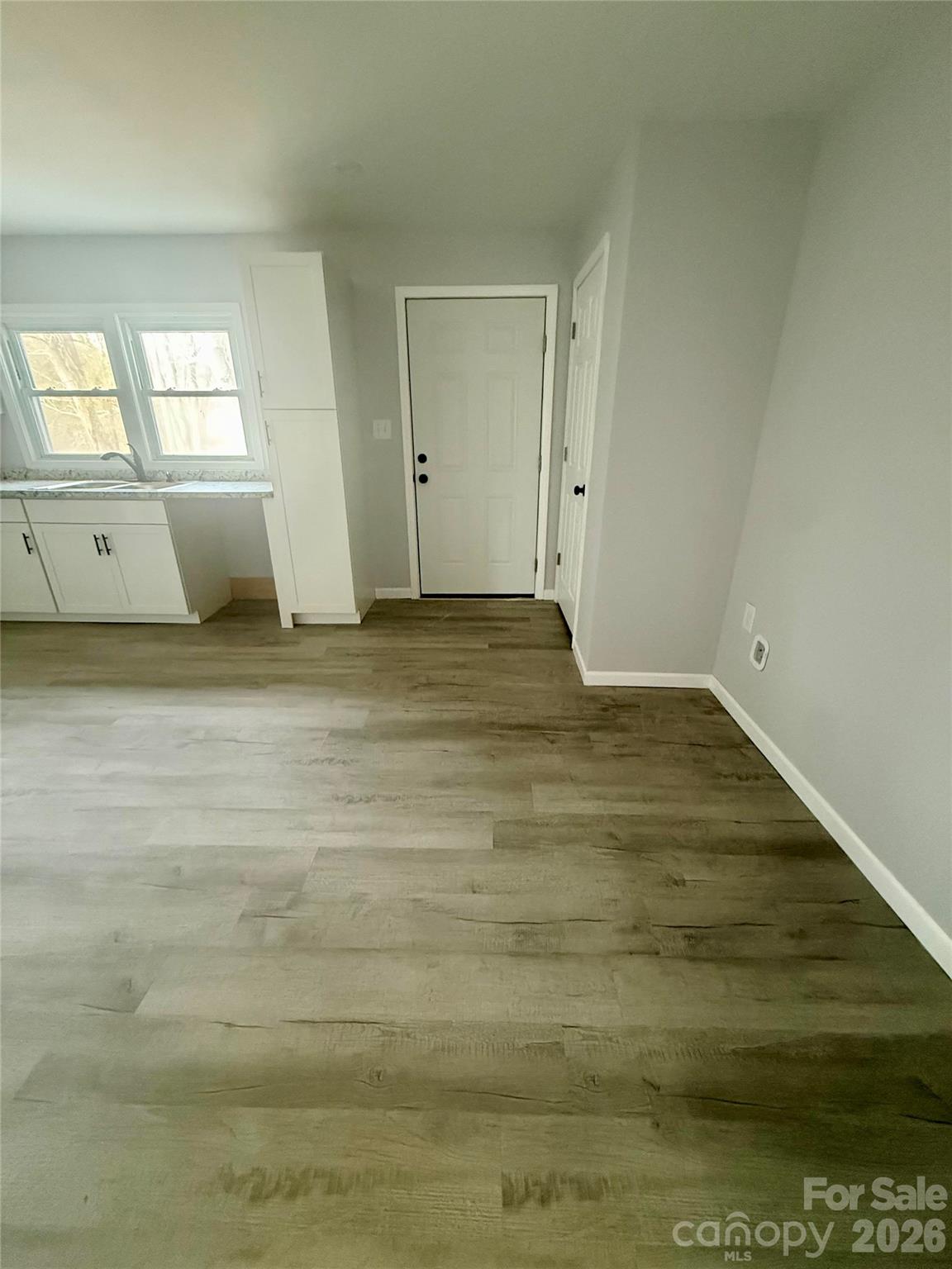 6457 Hudlow Road Union Mills, NC 28167 - Photo 6 of 14 a view of empty room with window and wooden floor