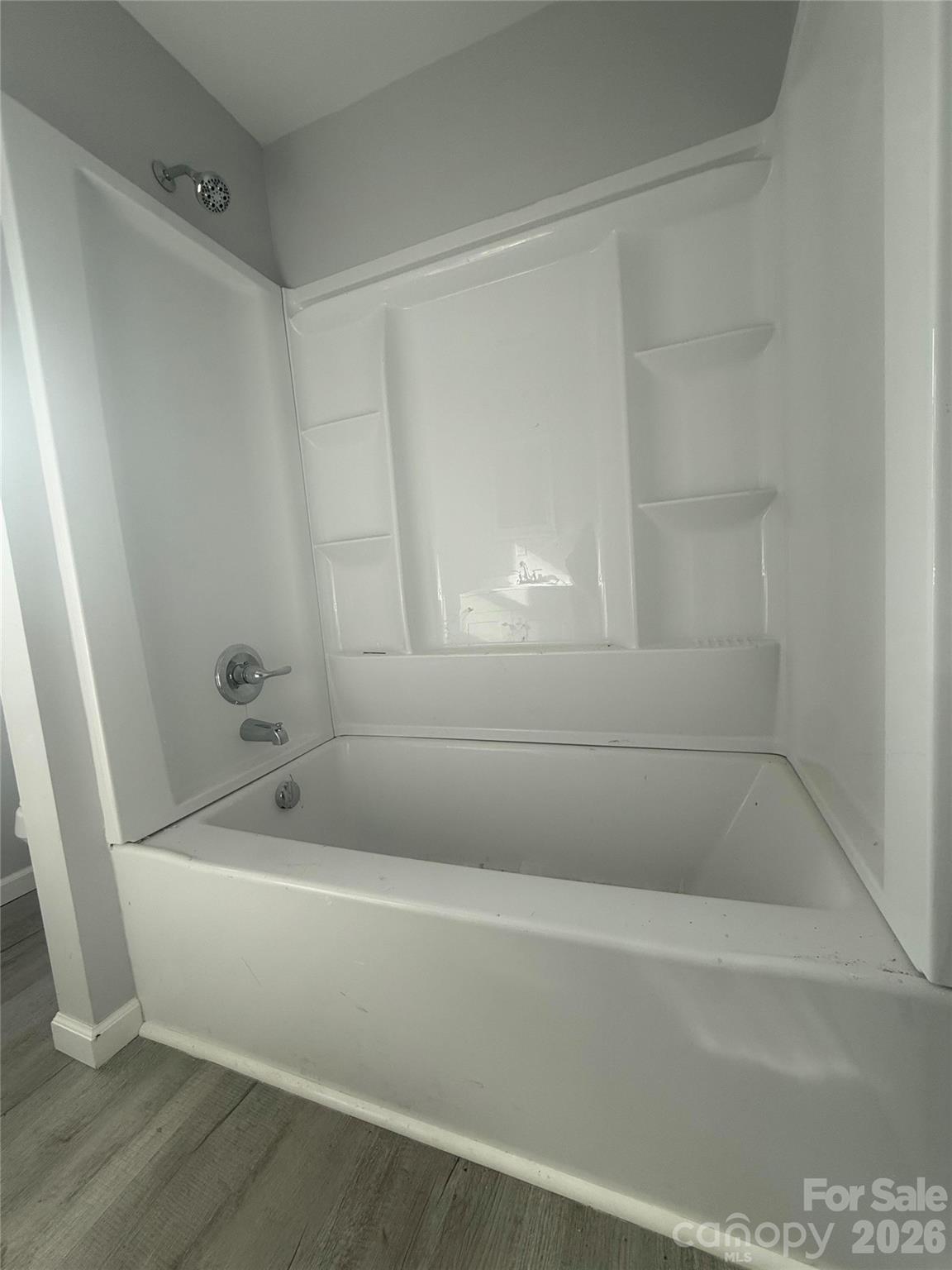 6457 Hudlow Road Union Mills, NC 28167 - Photo 10 of 14 a bathroom with a bathtub