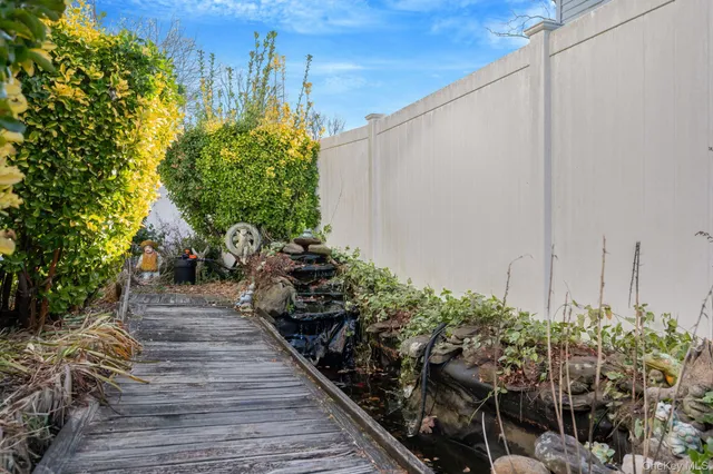 a view of a chairs and table on the roof deck