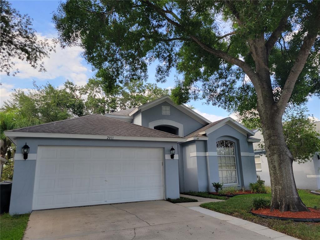 2011 Cattleman Drive Brandon, FL 33511 - Photo 2 of 40 a front view of a house with yard