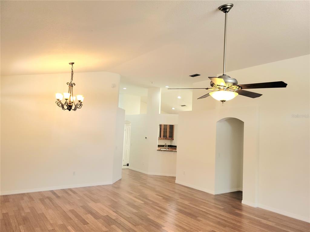 2011 Cattleman Drive Brandon, FL 33511 - Photo 21 of 40 a view of a room with wooden floor and ceiling fan