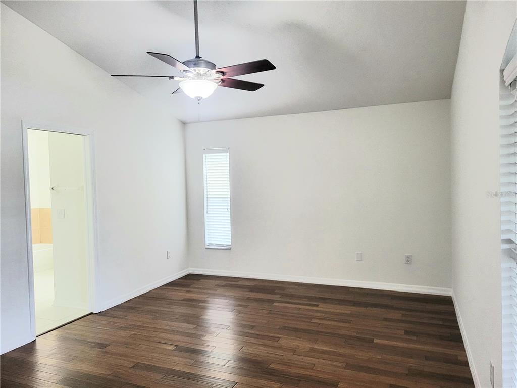 2011 Cattleman Drive Brandon, FL 33511 - Photo 26 of 40 a view of a room with wooden floor and a ceiling fan