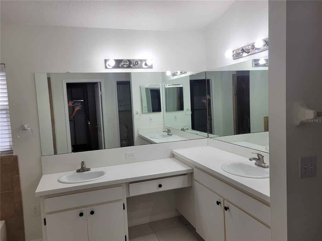 2011 Cattleman Drive Brandon, FL 33511 - Photo 31 of 40 a bathroom with a double vanity sink and a mirror