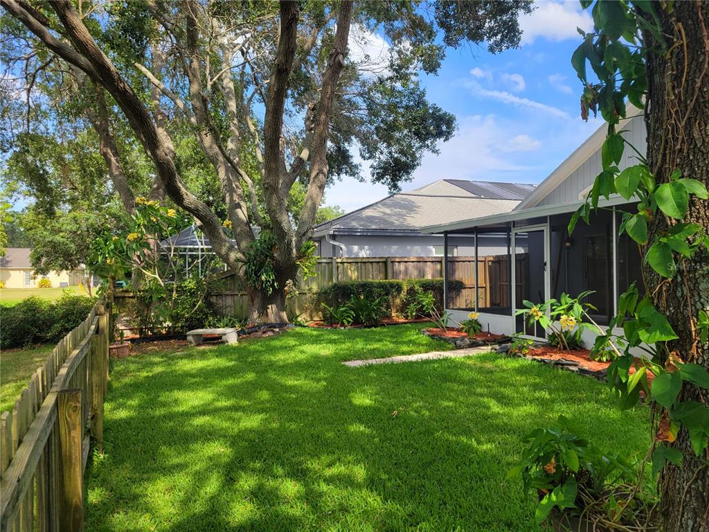 2011 Cattleman Drive Brandon, FL 33511 - Photo 34 of 40 a front view of a house with a yard table and chairs