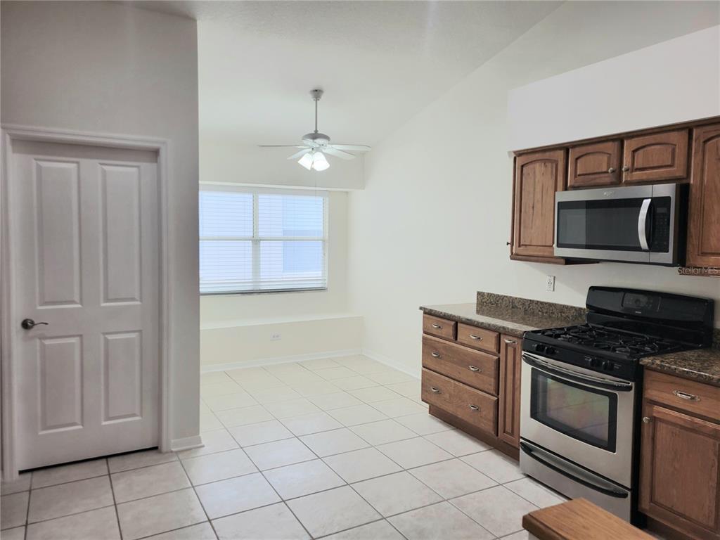 2011 Cattleman Drive Brandon, FL 33511 - Photo 7 of 40 a kitchen with cabinets and steel appliances